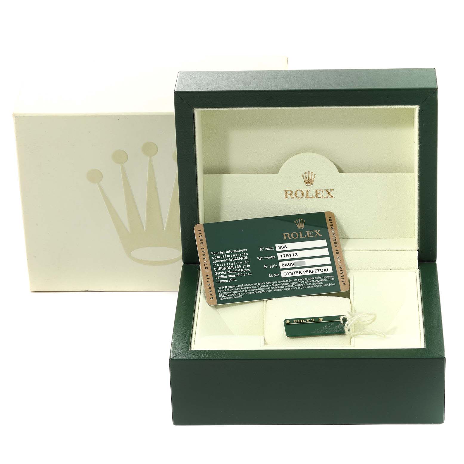 This image shows the open packaging box, tag, and warranty card for a Rolex Datejust 179173 Women's Steel and Gold (two tone) White Dial 179173 Women's Steel and Gold (two tone) White Dial model watch.
