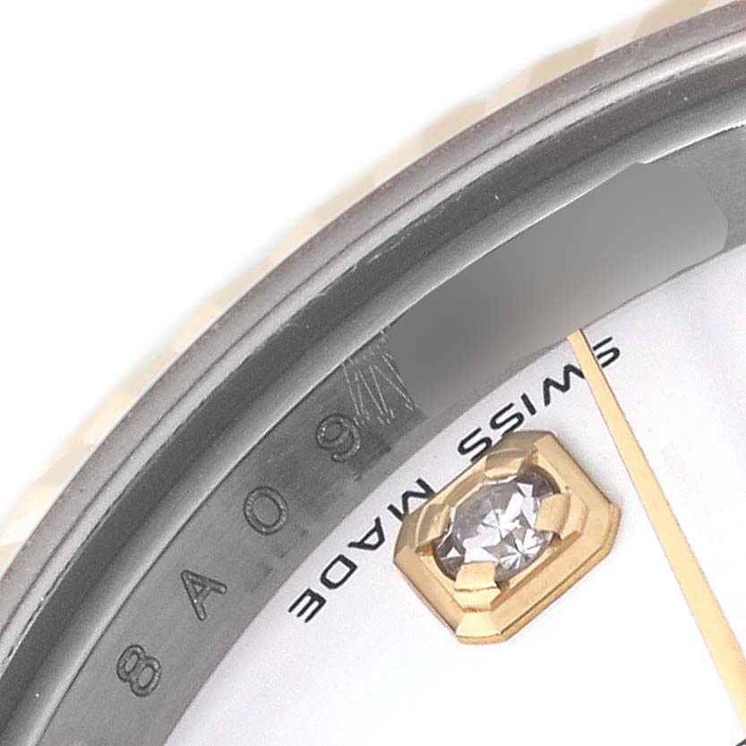 The image shows a close-up of a Rolex Datejust 179173 Women's Steel and Gold (two tone) White Dial 179173 Women's Steel and Gold (two tone) White Dial watch's dial, focusing on the diamond hour marker and the "SWISS MADE" inscription.