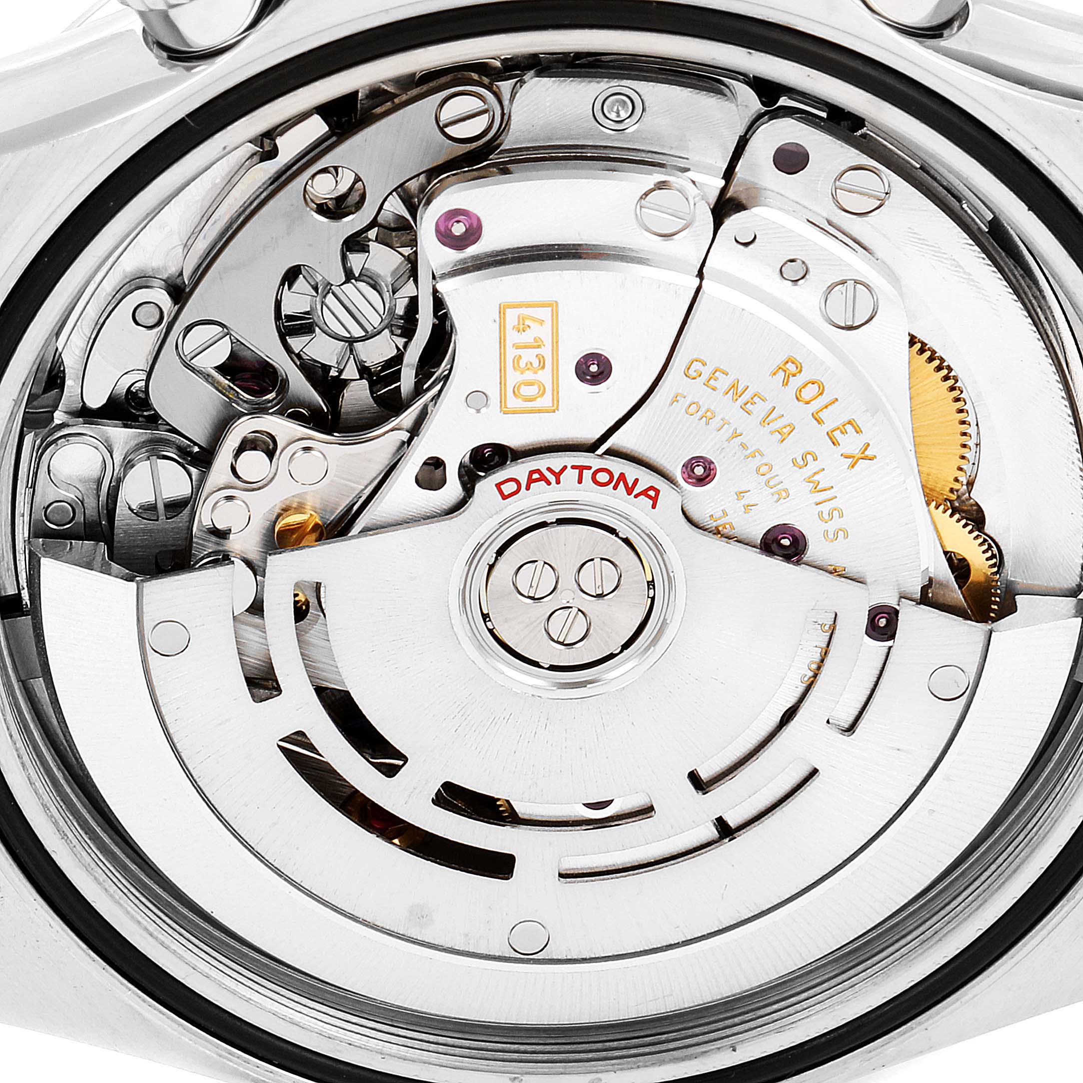 This close-up image shows the internal movement mechanism of a Rolex Daytona 116520 Men's Stainless Steel Black Dial 116520 Men's Stainless Steel Black Dial watch, highlighting the intricate gears and parts.