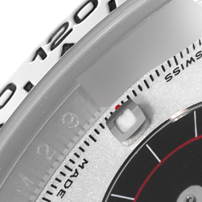 This close-up shows the bezel and part of the dial of a Rolex Daytona 116519 Men's White Gold Silver Dial 116519 Men's White Gold Silver Dial watch.
