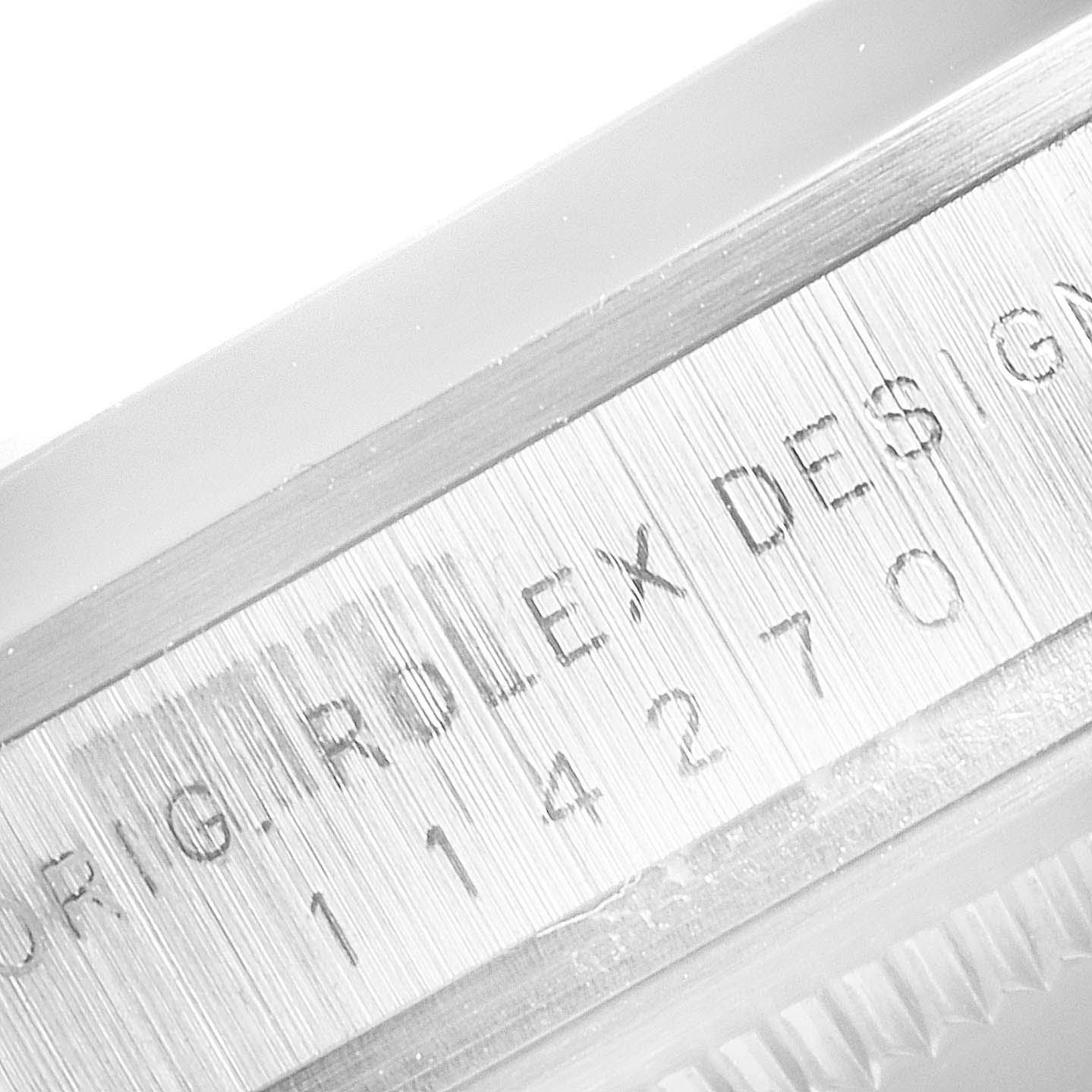 This image shows a close-up of the side engraving on the case of a Rolex Explorer 114270 Men
s Stainless Steel Black Dial 114270 Men
s Stainless Steel Black Dial watch.