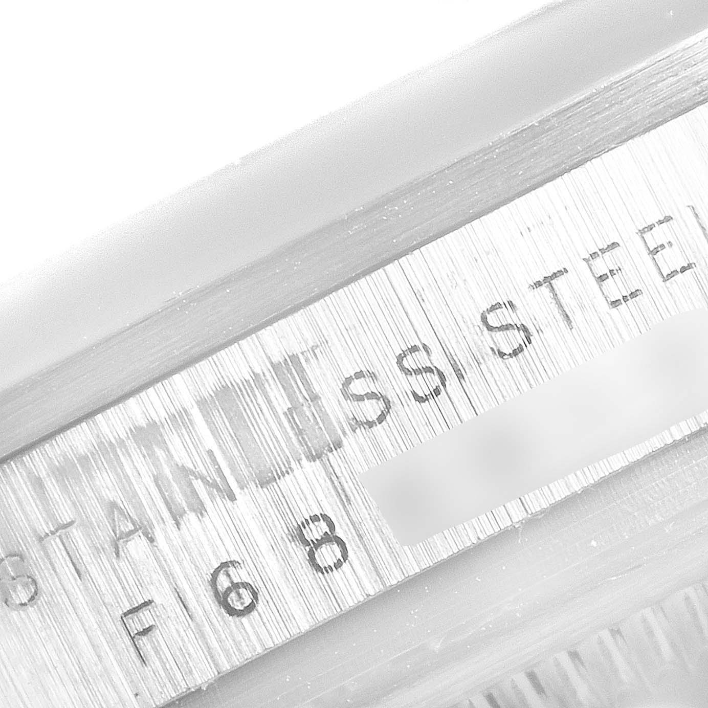 This close-up image shows the engraved stainless steel part and partial serial number of the Rolex Explorer 114270 Men
s Stainless Steel Black Dial 114270 Men
s Stainless Steel Black Dial model.