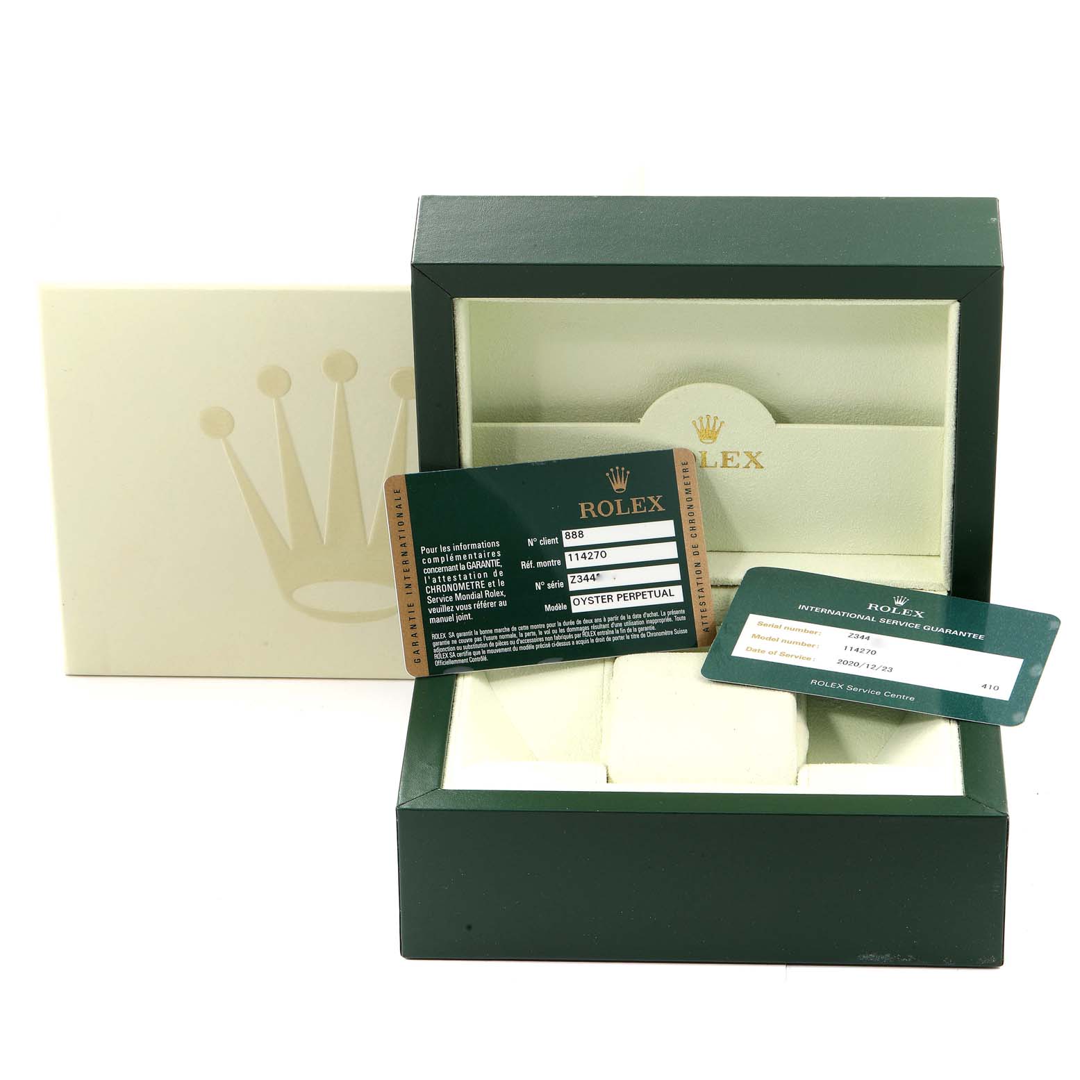 The image shows the packaging and authenticity cards for the Rolex Explorer 114270 Men's Stainless Steel Black Dial 114270 Men's Stainless Steel Black Dial model, with the box open and cards displayed in front.