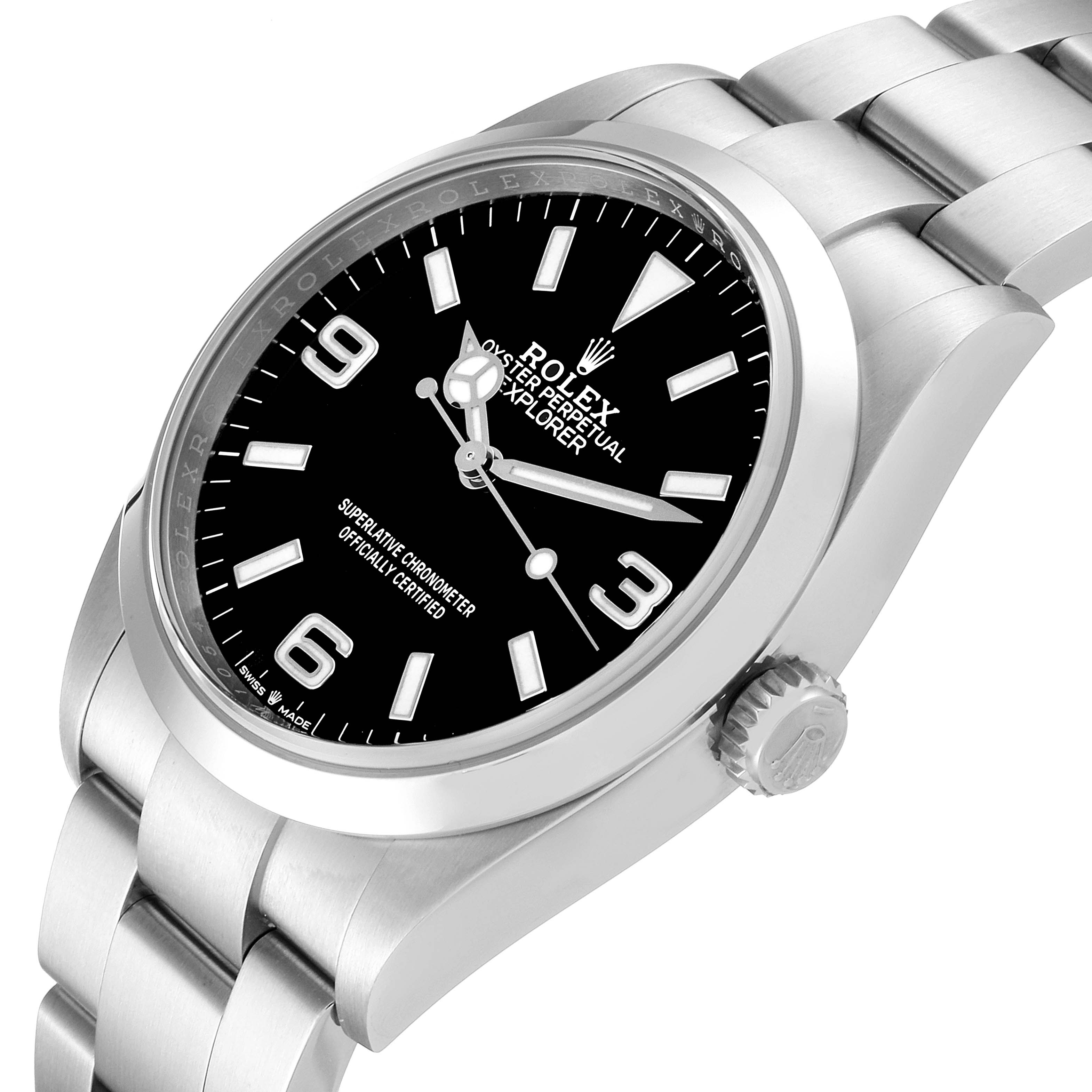 The image shows a Rolex Explorer 124270 Men
s Stainless Steel Black Dial 124270 Men
s Stainless Steel Black Dial watch at an angled side view, featuring its bezel, dial, and bracelet.