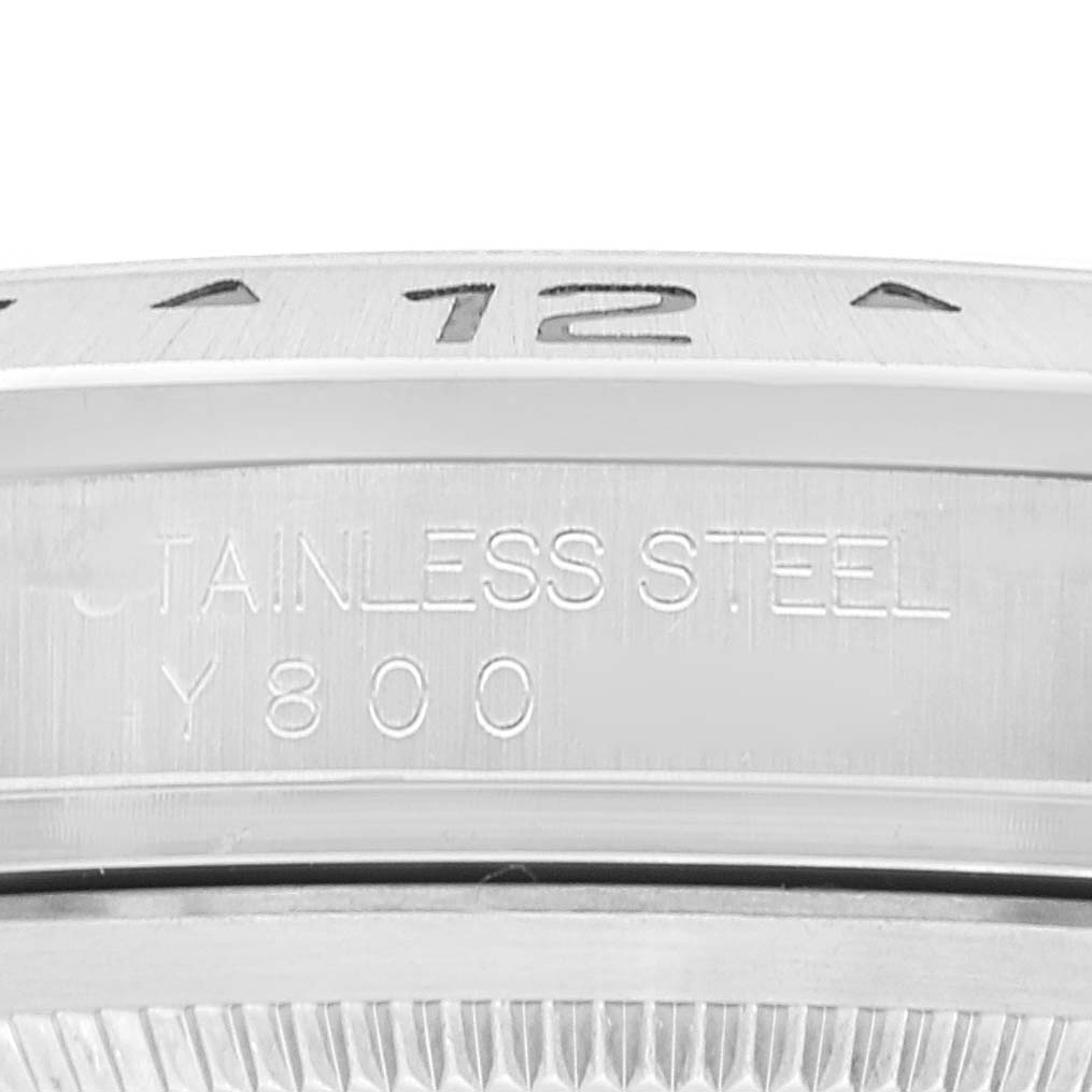 The image shows a close-up of the bezel and outer edge of the case back of a Rolex Explorer 16570 Men's Stainless Steel White Dial 16570 Men's Stainless Steel White Dial watch, indicating "STAINLESS STEEL" and "Y800".