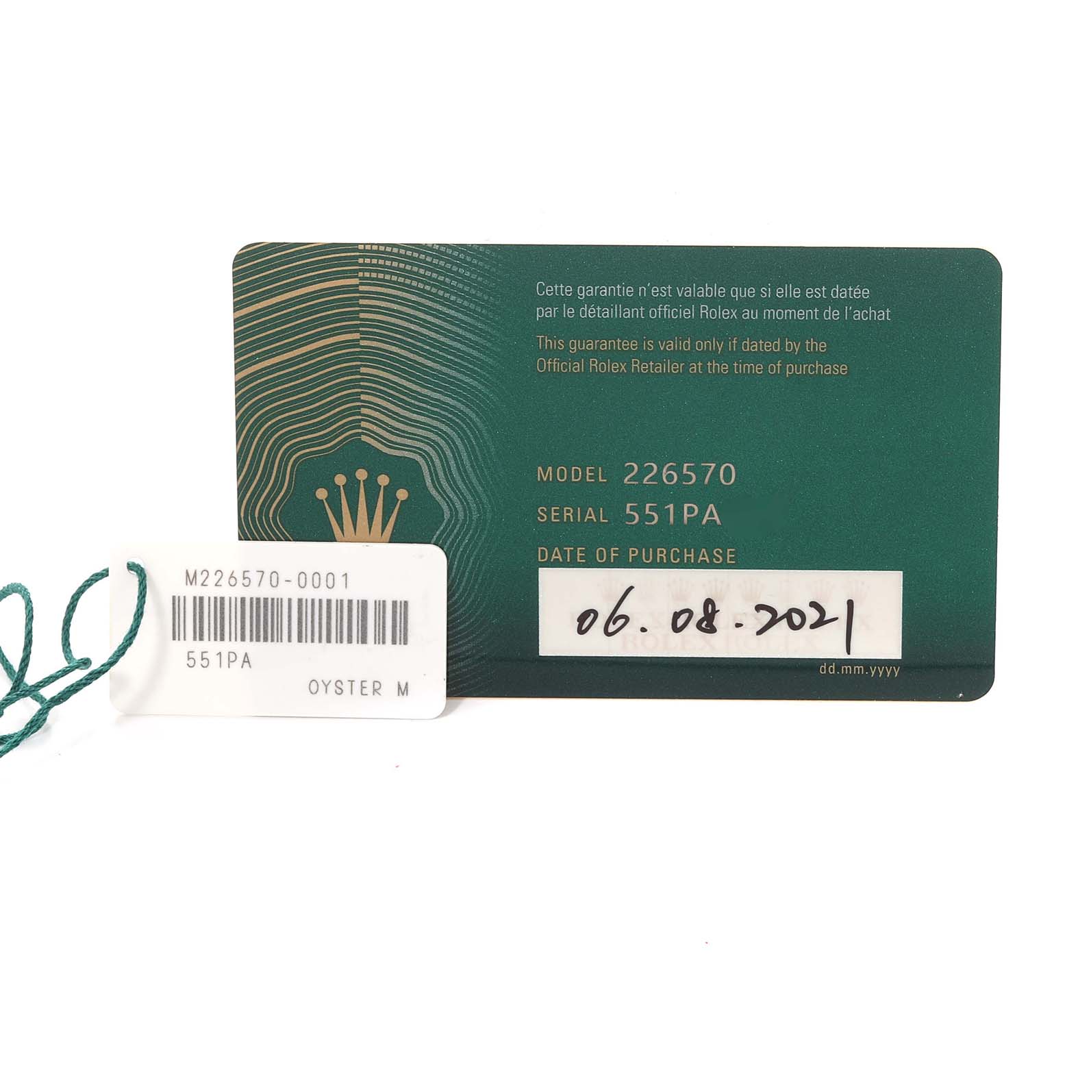 The image shows a warranty card and tag for a Rolex Explorer 226570 Men's Stainless Steel White Dial 226570 Men's Stainless Steel White Dial model, including the model and serial numbers.