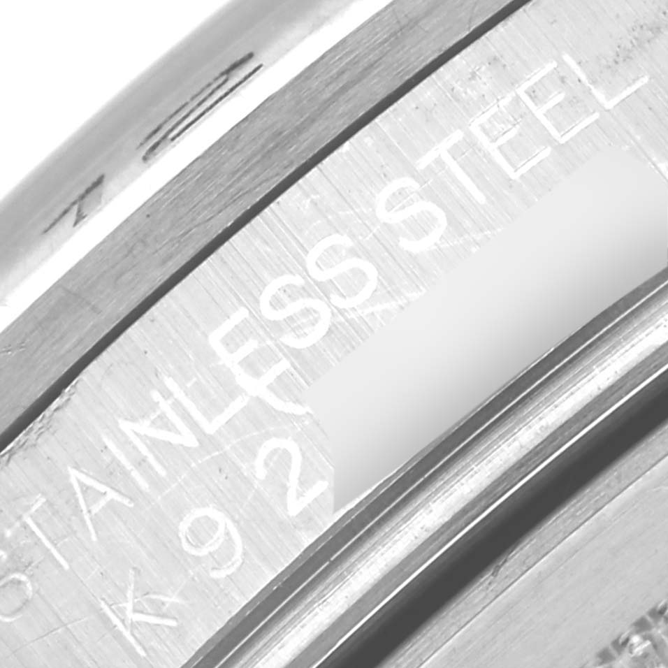The image shows a close-up angle of the stainless steel case back of a Rolex Explorer 16570 Men's Stainless Steel White Dial 16570 Men's Stainless Steel White Dial watch.