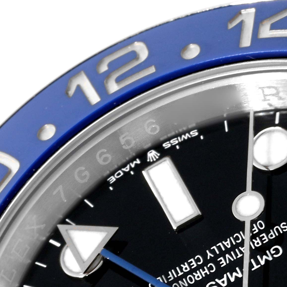 This close-up angle of the Rolex GMT-Master 126710BLNR Men's Stainless Steel Black Dial 126710BLNR Men's Stainless Steel Black Dial watch shows part of the blue bezel and partial view of the dial with hour markers and hands.