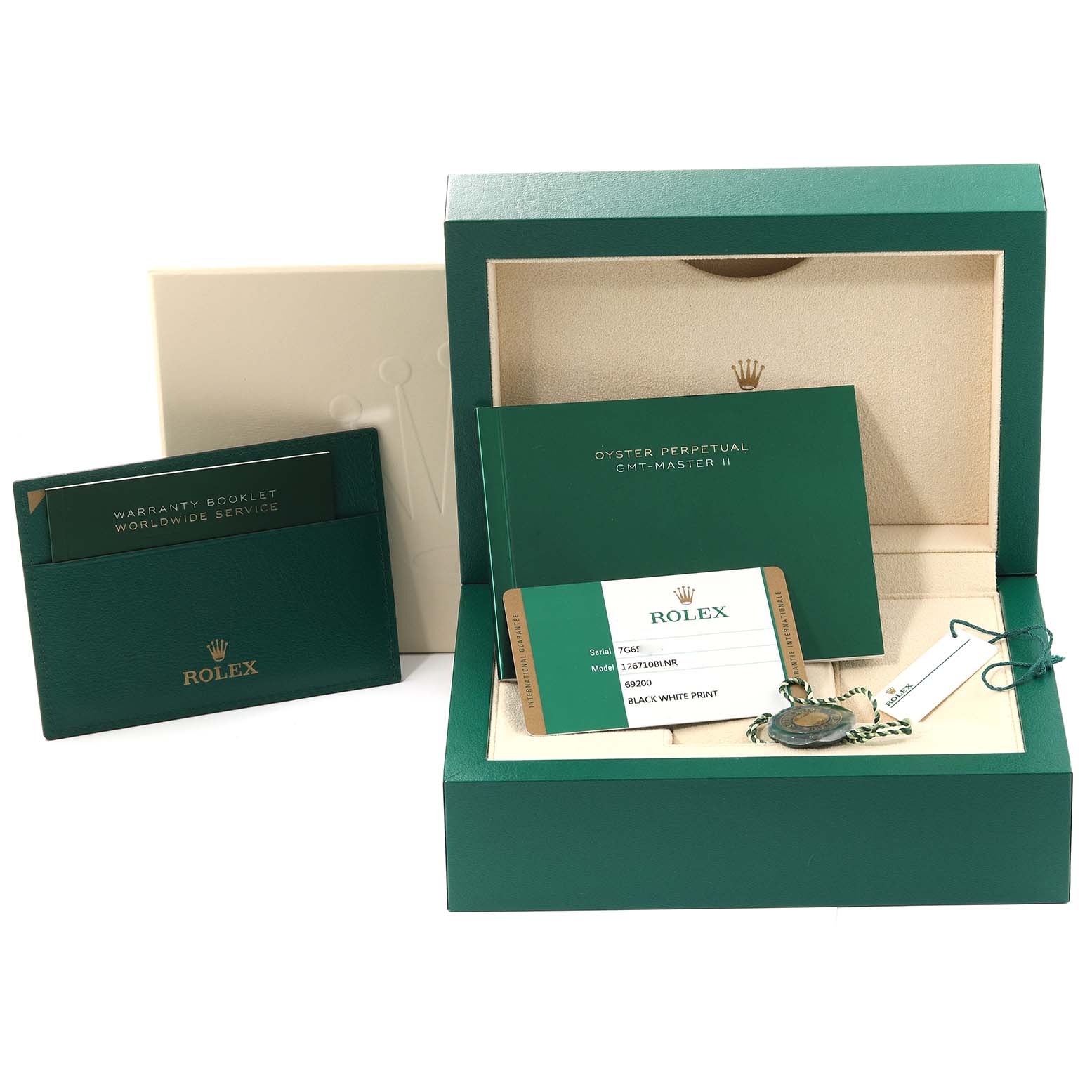 The image shows a Rolex GMT-Master 126710BLNR Men's Stainless Steel Black Dial 126710BLNR Men's Stainless Steel Black Dial watch's box, warranty booklet, owner's manual, and tags from a front angle.