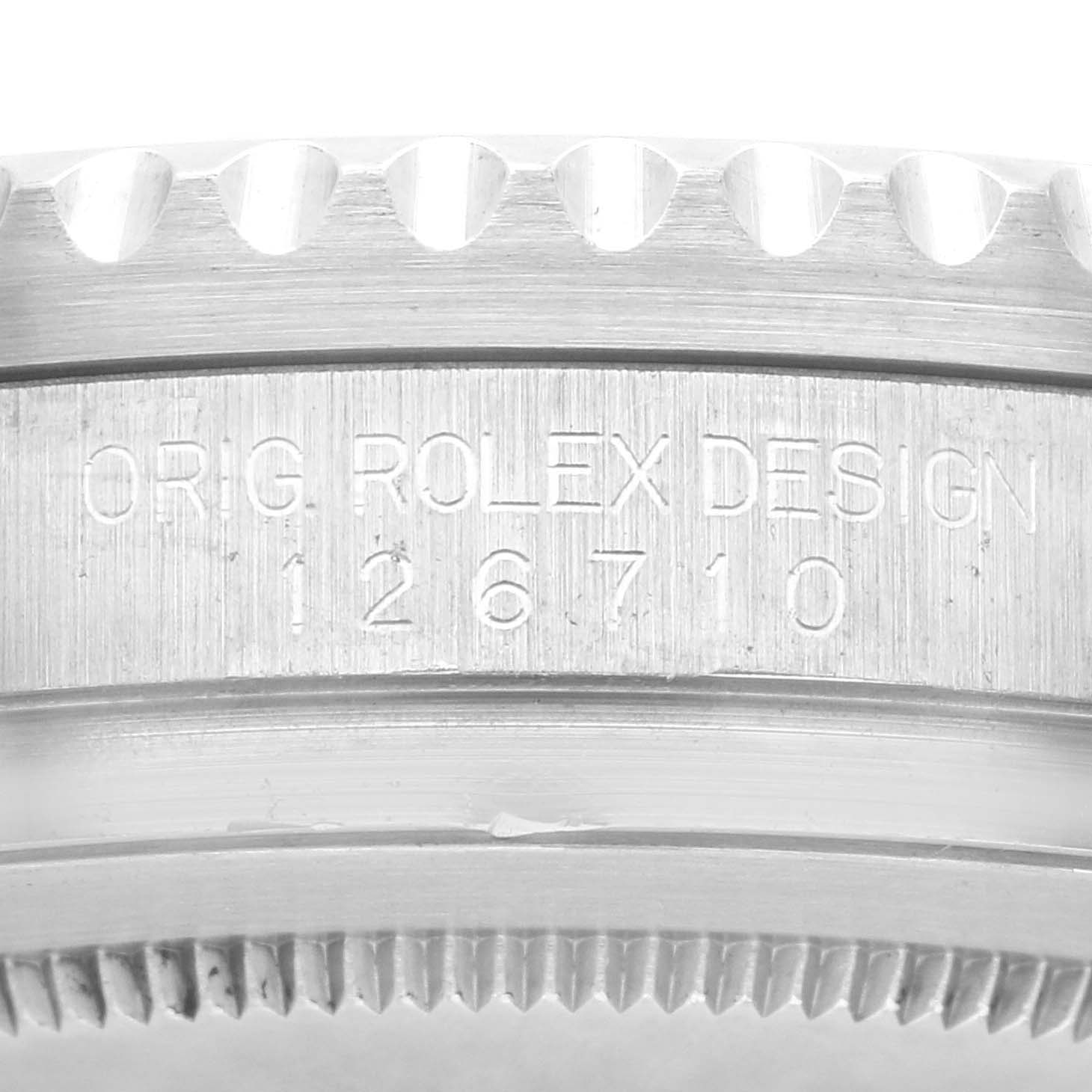 This close-up image shows the engraved model and reference number on the side of a Rolex GMT-Master 126710BLNR Men's Stainless Steel Black Dial 126710BLNR Men's Stainless Steel Black Dial watch case.