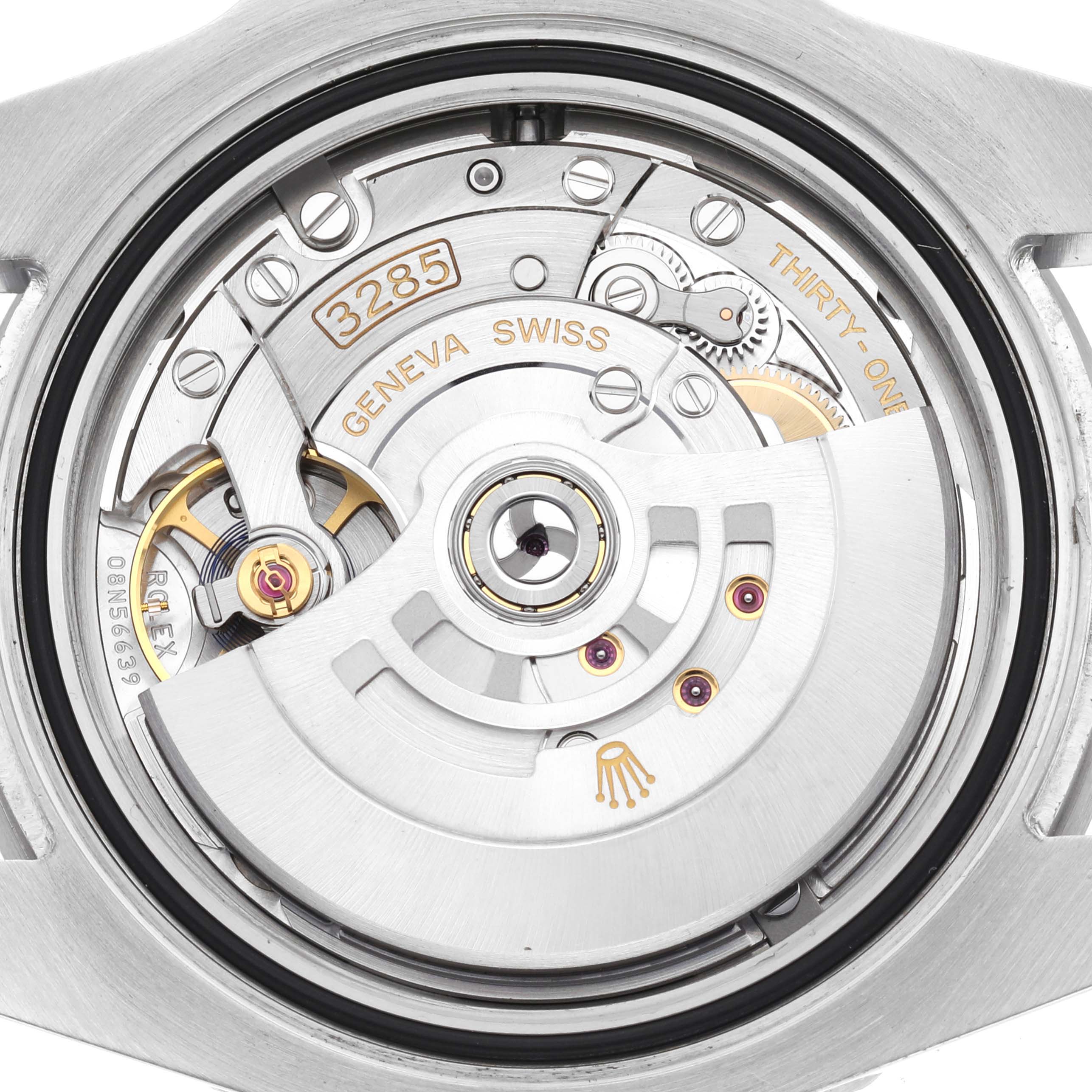 The image shows the inner watch movement of a Rolex GMT-Master 126710BLNR Men's Stainless Steel Black Dial 126710BLNR Men's Stainless Steel Black Dial model from the back angle, featuring rotor, gears, and inscriptions.