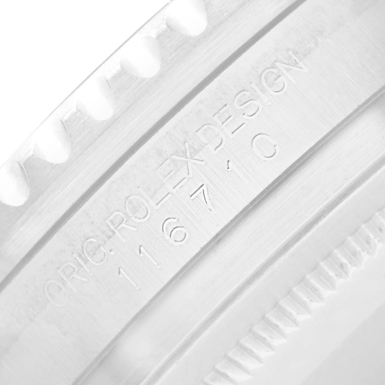 The image shows a close-up of the engraved inner bezel on a Rolex GMT-Master 116710 Men
s Stainless Steel Black Dial watch.