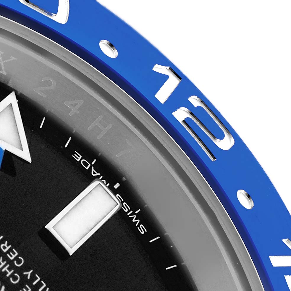 The image shows a close-up of the bezel and part of the dial of the Rolex GMT-Master 116710 Men
s Stainless Steel Black Dial watch, highlighting the blue color and numerals.