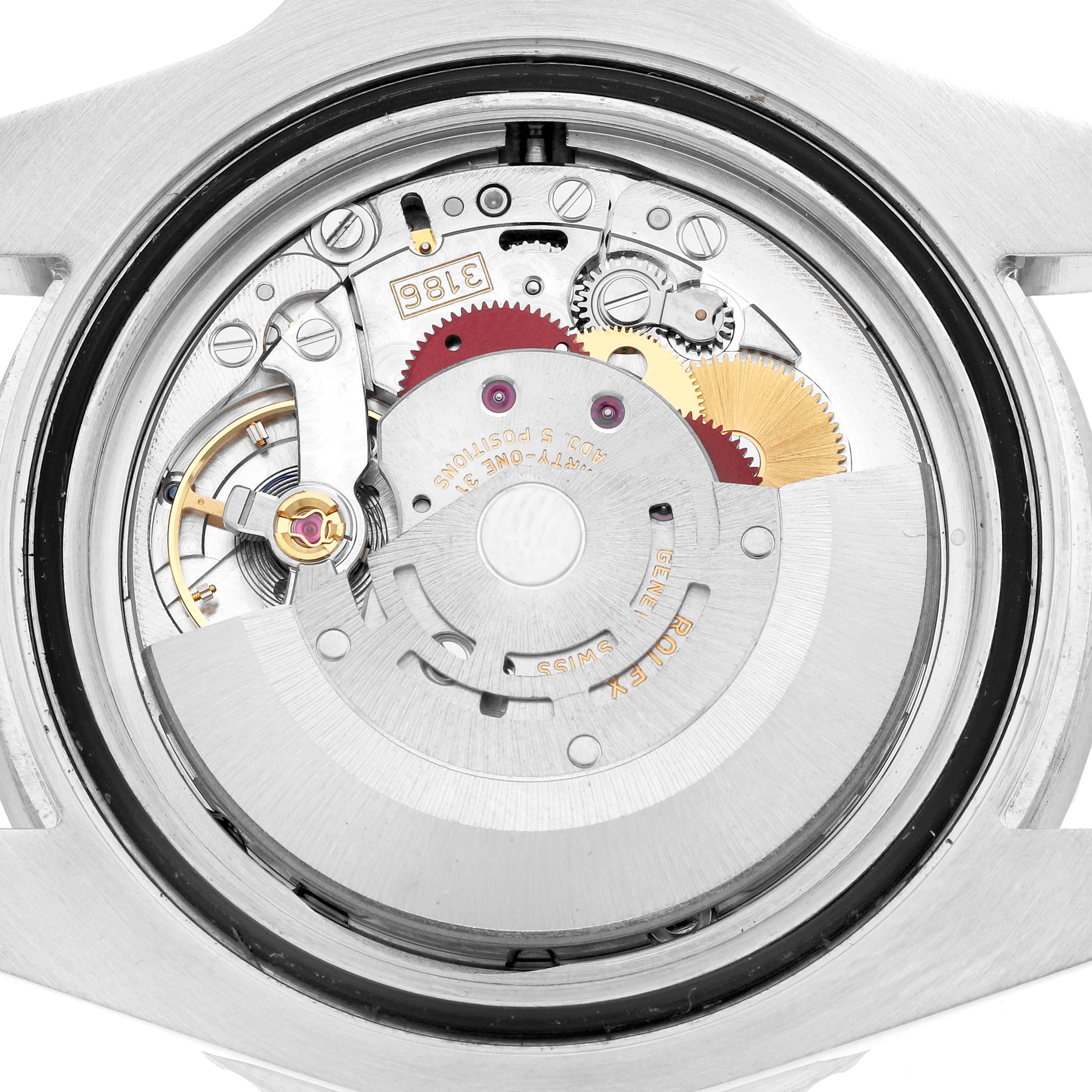 The image shows the movement mechanism of a Rolex GMT-Master 116710 Men
s Stainless Steel Black Dial, viewed from the back, displaying gears and the rotor.