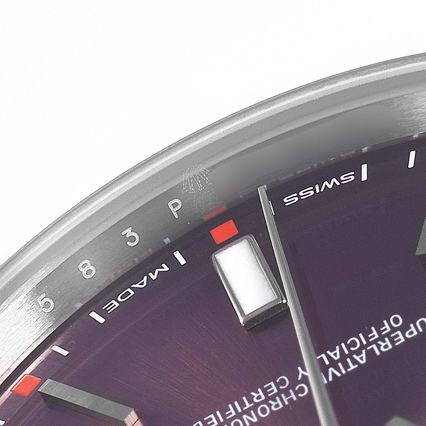 This image shows a close-up of the dial and hour markers on a Rolex Oyster Perpetual 114300 Men's Stainless Steel Burgundy Dial 114300 Men's Stainless Steel Burgundy Dial watch.