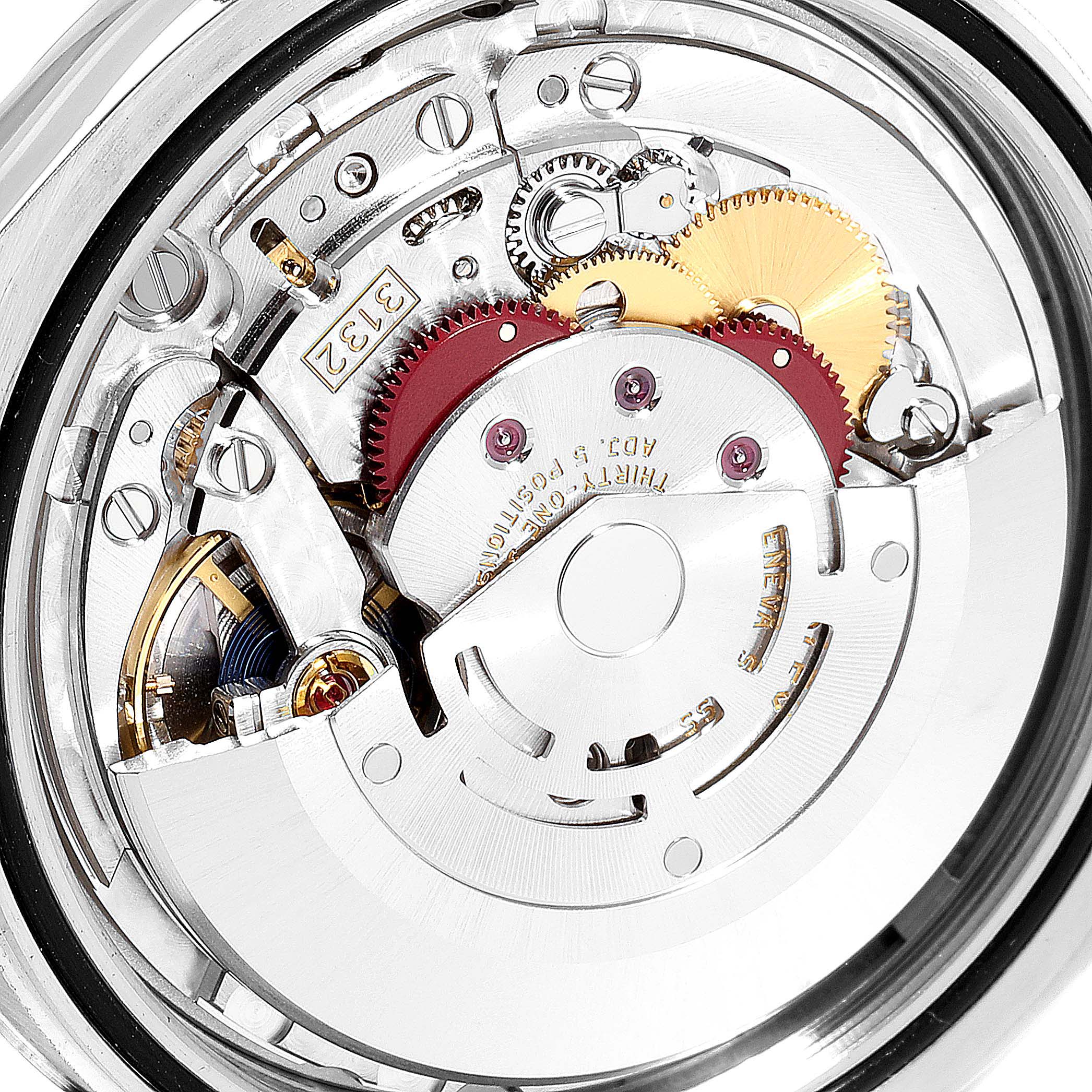 This image shows the internal mechanism of a Rolex Oyster Perpetual 114300 Men's Stainless Steel Burgundy Dial 114300 Men's Stainless Steel Burgundy Dial watch, highlighting various gears and components.