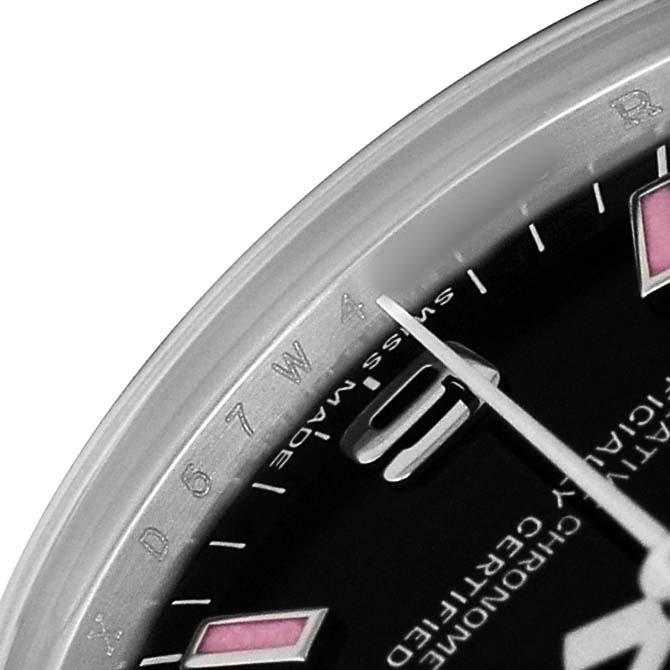 The image shows a close-up of the dial and bezel of a Rolex Oyster Perpetual 177234 Women's Stainless Steel Black Dial watch, featuring hour markers and part of the watch hand.