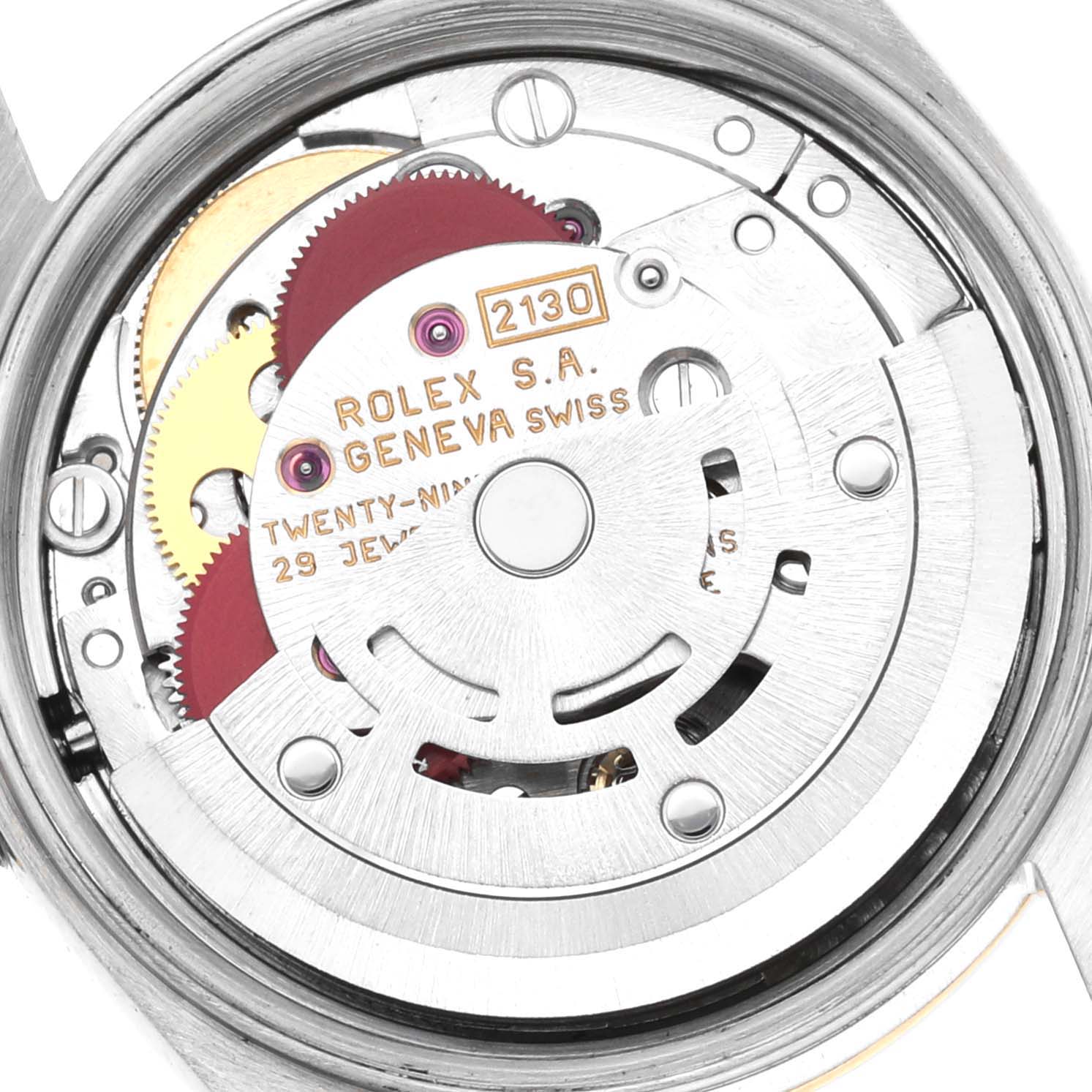 The image shows a close-up of the movement inside a Rolex Oyster Perpetual 67183 Women's Steel and Gold (two tone) Grey Dial 67183 Women's Steel and Gold (two tone) Grey Dial watch, highlighting gears and the rotor.