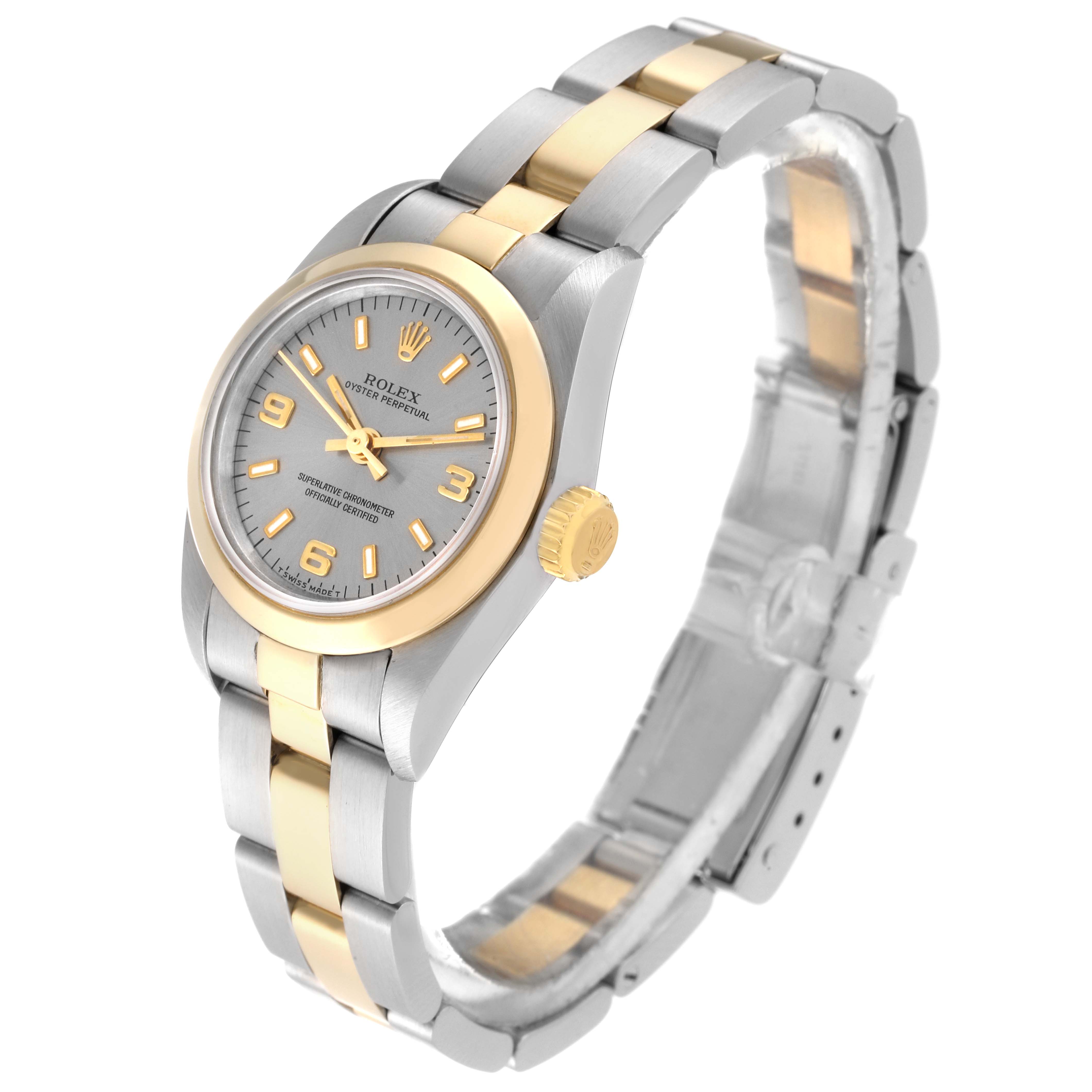 The Rolex Oyster Perpetual 67183 Women's Steel and Gold (two tone) Grey Dial 67183 Women's Steel and Gold (two tone) Grey Dial watch is shown in a side angle, highlighting the silver and gold bracelet and the detailed face.