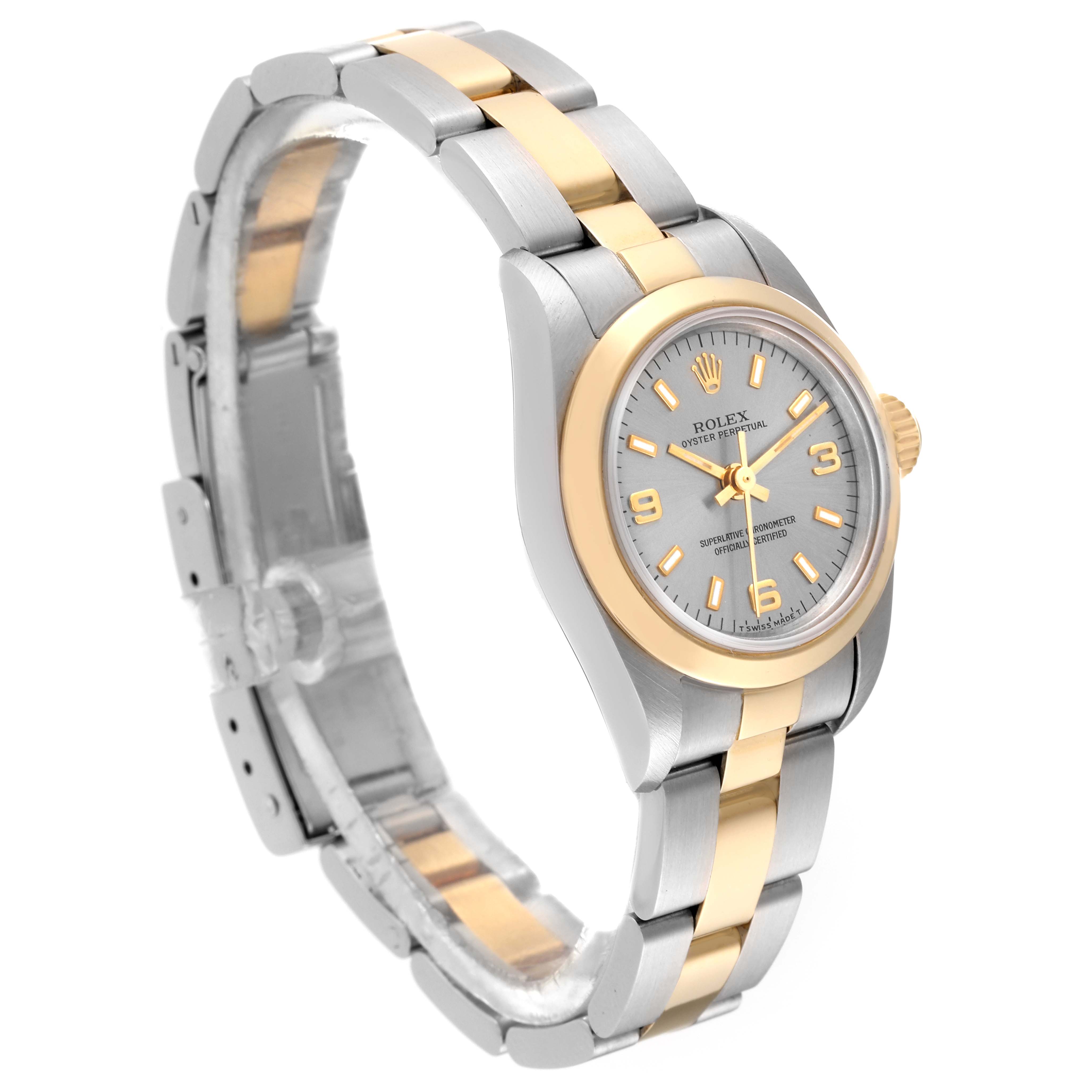 This image shows a Rolex Oyster Perpetual 67183 Women's Steel and Gold (two tone) Grey Dial 67183 Women's Steel and Gold (two tone) Grey Dial watch at a three-quarter angle, highlighting its two-tone band, case, and face.