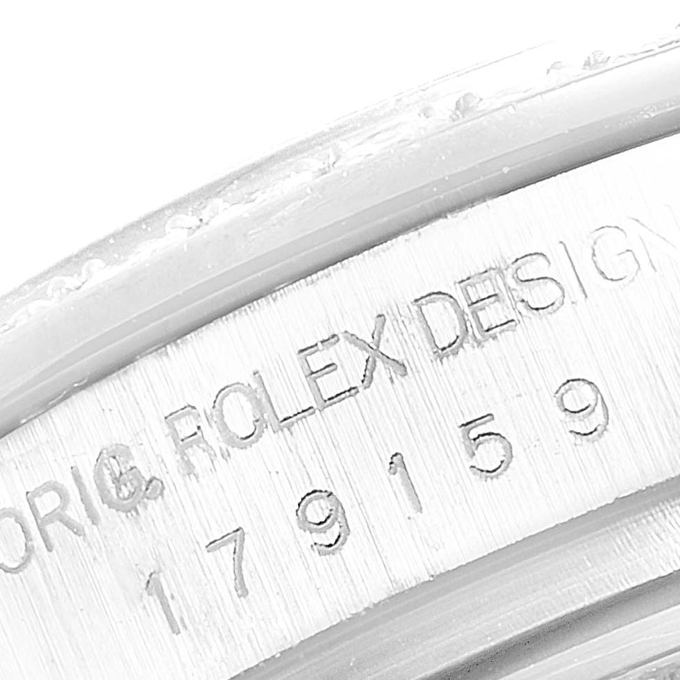 The image shows a close-up angle of the case side of a Rolex President 179159 Women's White Gold Mother of Pearl Dial 179159 Women's White Gold Mother of Pearl Dial watch, displaying the model and serial numbers.