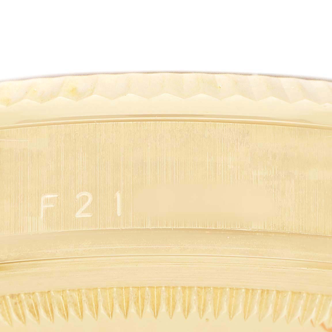 The image shows a close-up of the side view of a Rolex President 118238 Men's Yellow Gold Champagne Dial model, highlighting the case edge with engravings.