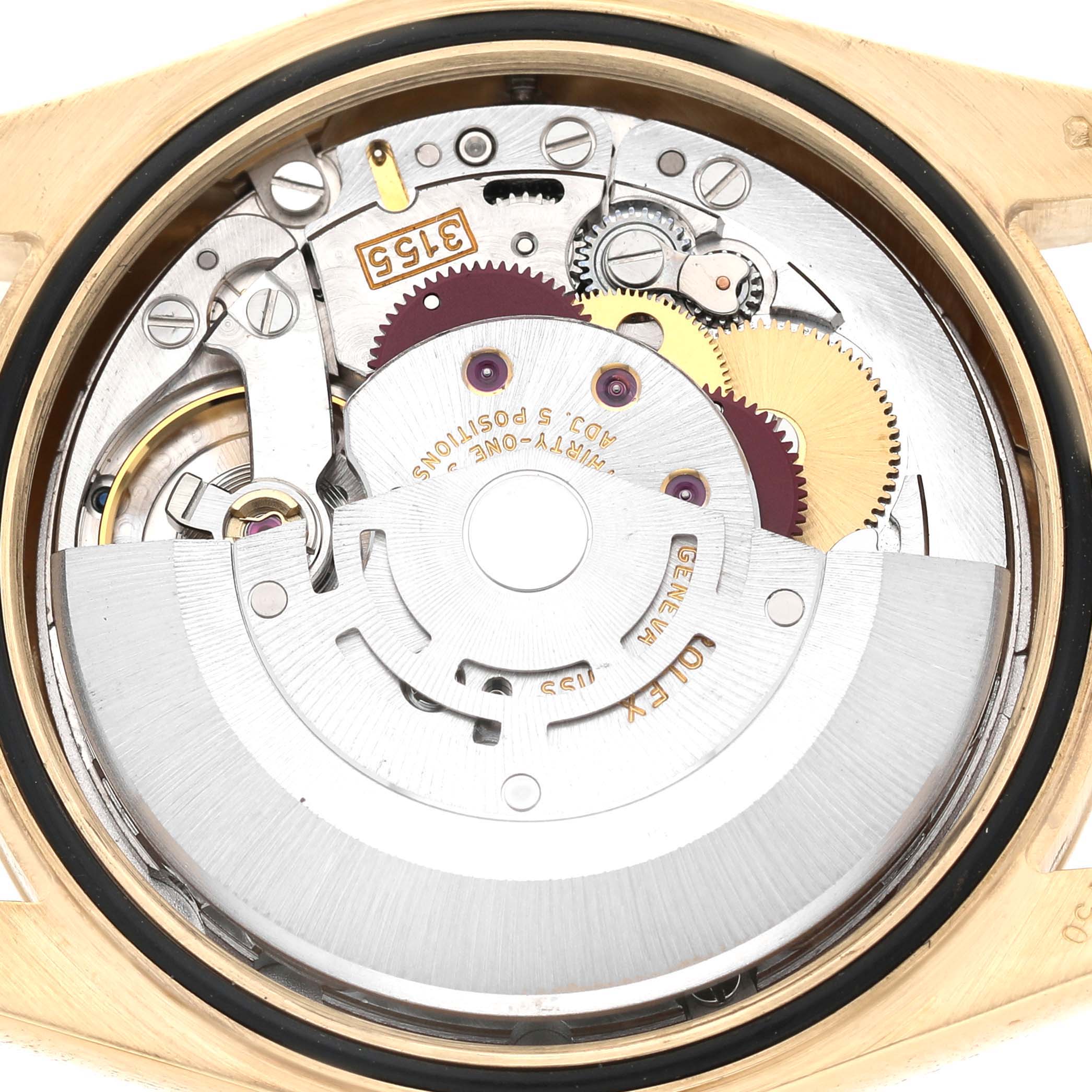The image shows the internal mechanism of a Rolex President 118238 Men's Yellow Gold Champagne Dial watch from a back view, highlighting gears and the rotor.