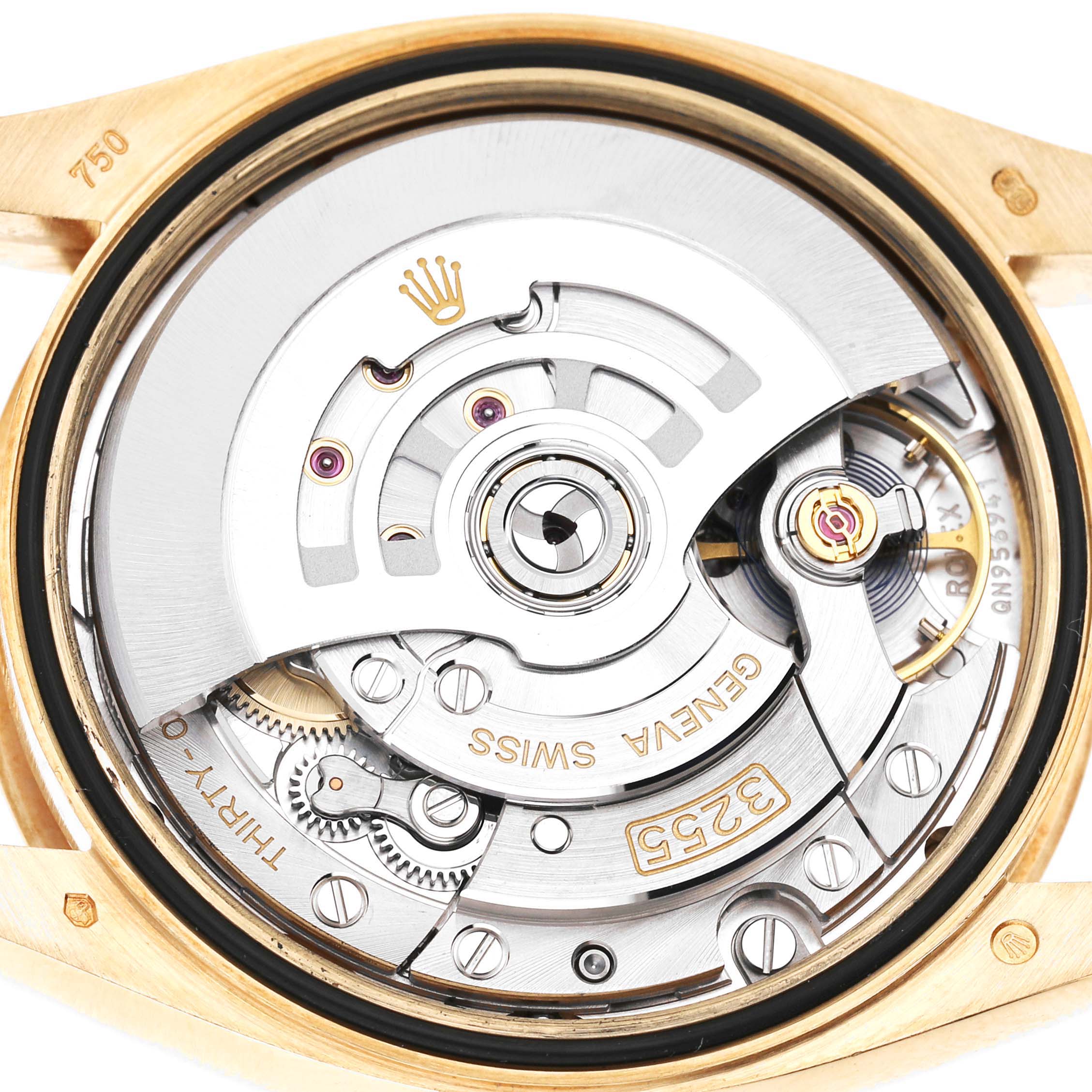 The image shows the internal movement mechanism of a Rolex President 128238 Men's Yellow Gold Grey Dial watch from a top-down angle.