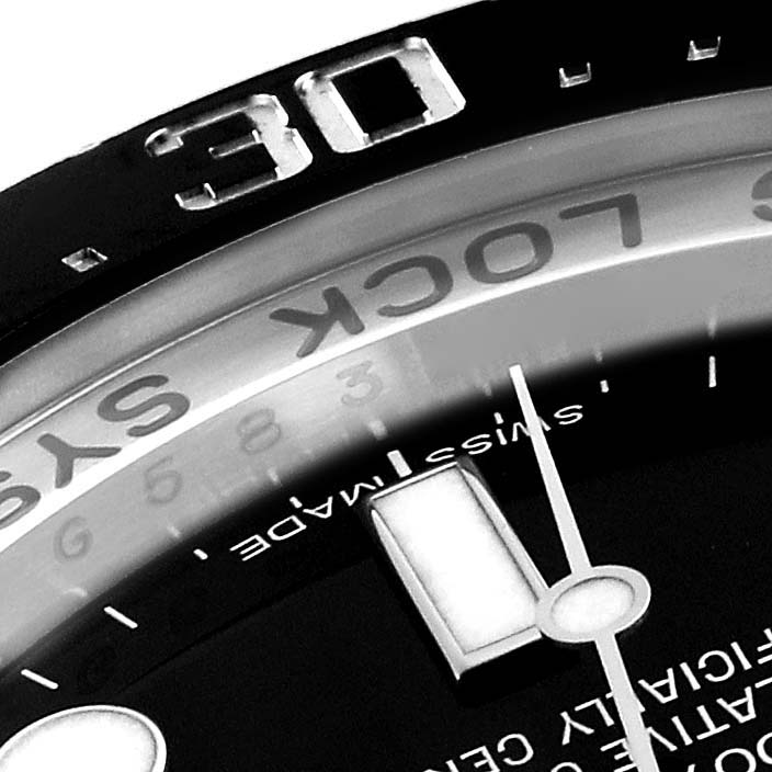 The image shows a close-up angle of the bezel and part of the dial of the Rolex Sea-Dweller 116660 Men's Stainless Steel Black Dial 116660 Men's Stainless Steel Black Dial watch.