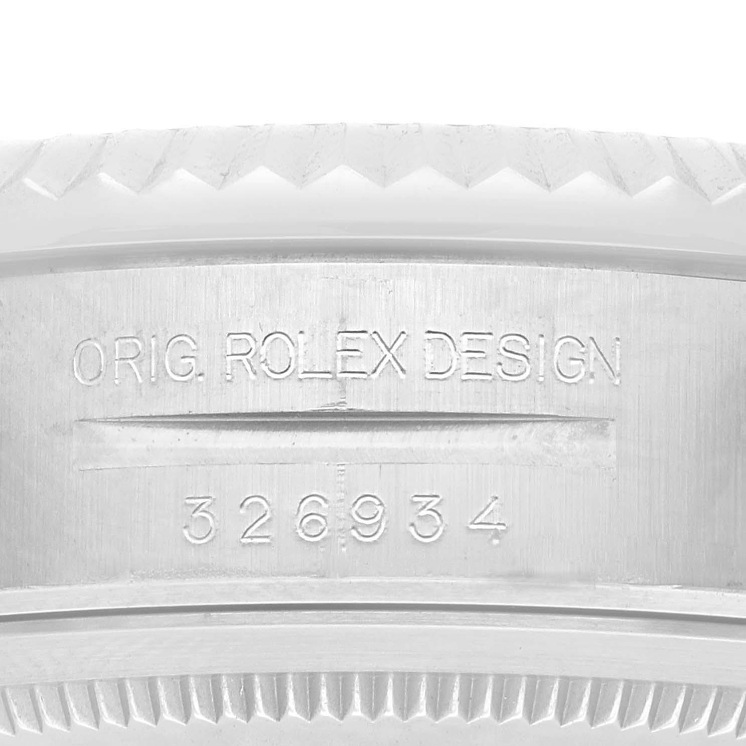 The image shows the side view of a Rolex Sky-Dweller 326934 Men
s Stainless Steel Blue Dial with focus on the engraved design details and serial number.