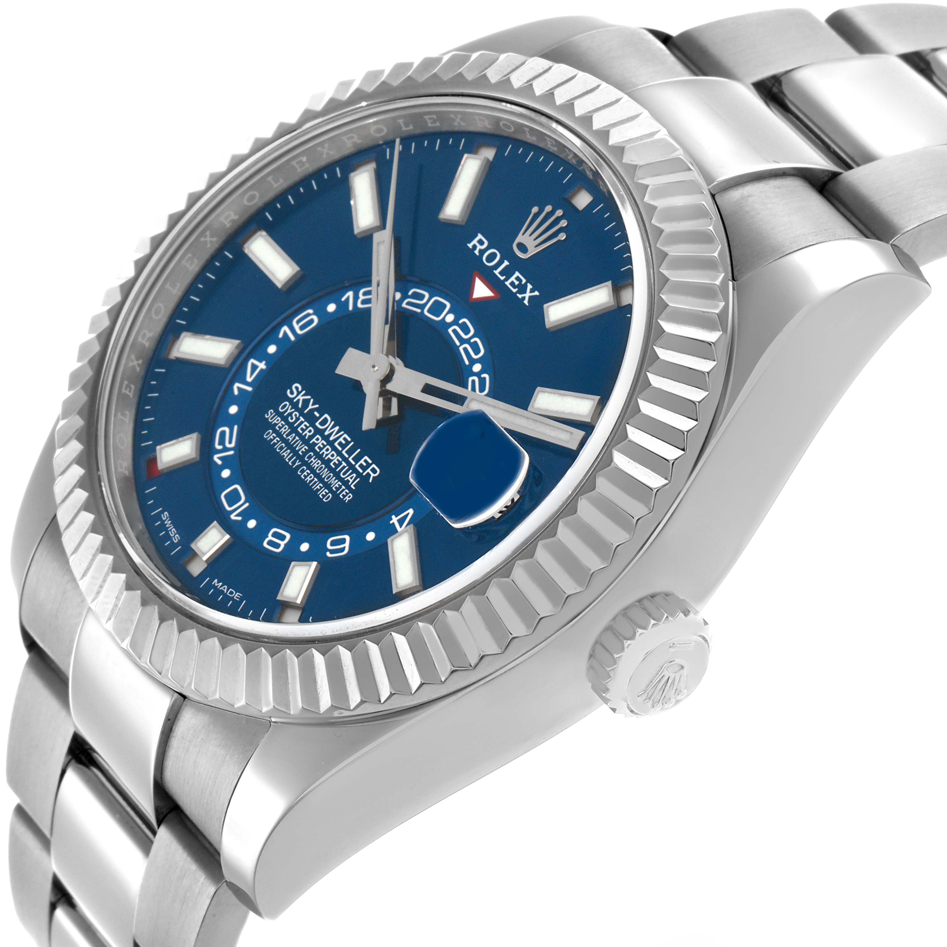 The Rolex Sky-Dweller 326934 Men
s Stainless Steel Blue Dial watch is shown at a three-quarter angle, highlighting the blue dial, fluted bezel, and part of the bracelet.