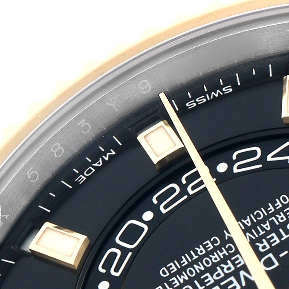 The image shows a close-up of the Rolex Sky-Dweller 326933 Men
s Steel and Gold (two tone) Black Dial, highlighting the dial, numeral details, and part of the hands.