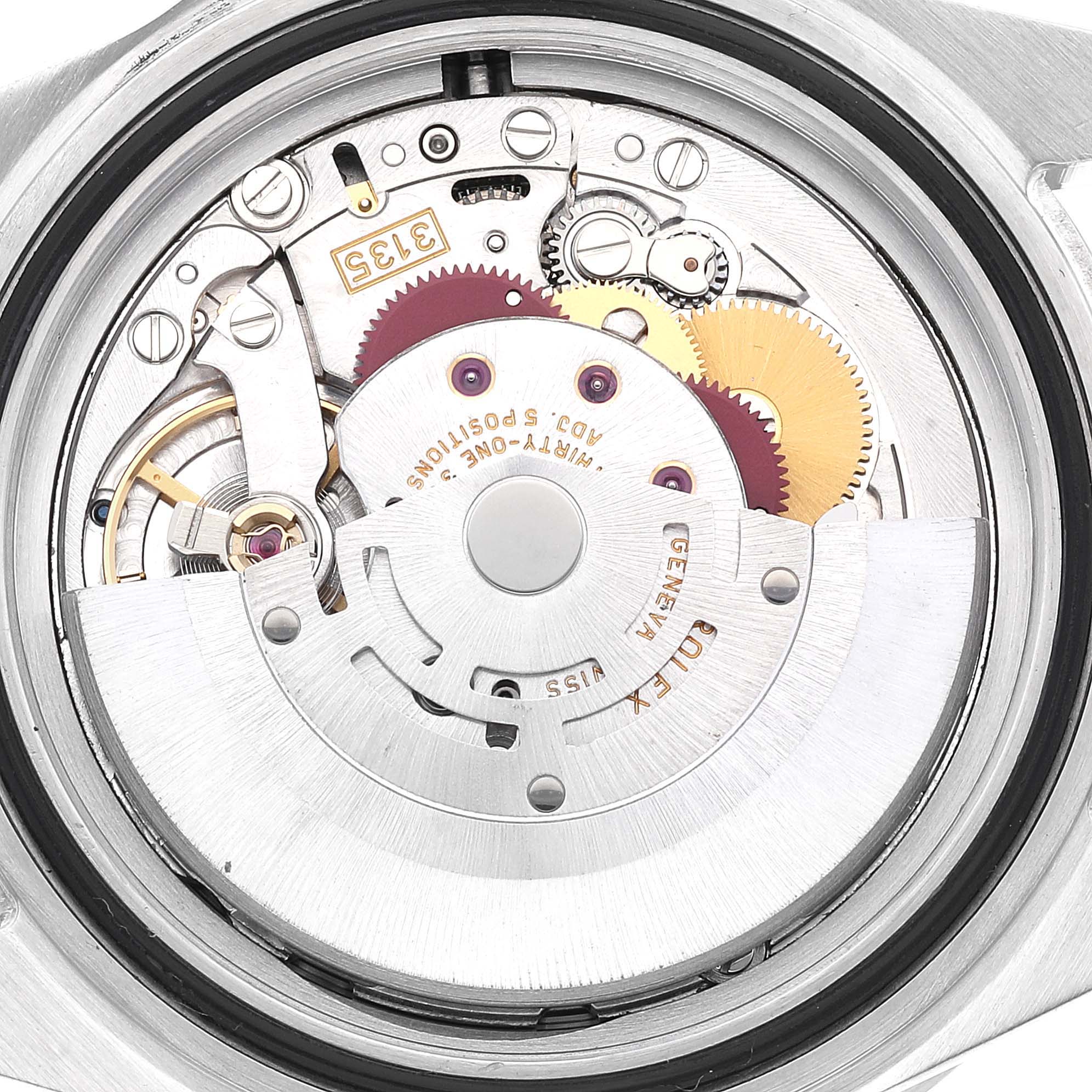 The image shows the movement mechanism from the back of a Rolex Submariner 16610 Men's Stainless Steel Black Dial 16610 Men's Stainless Steel Black Dial watch, highlighting intricate gears and components.