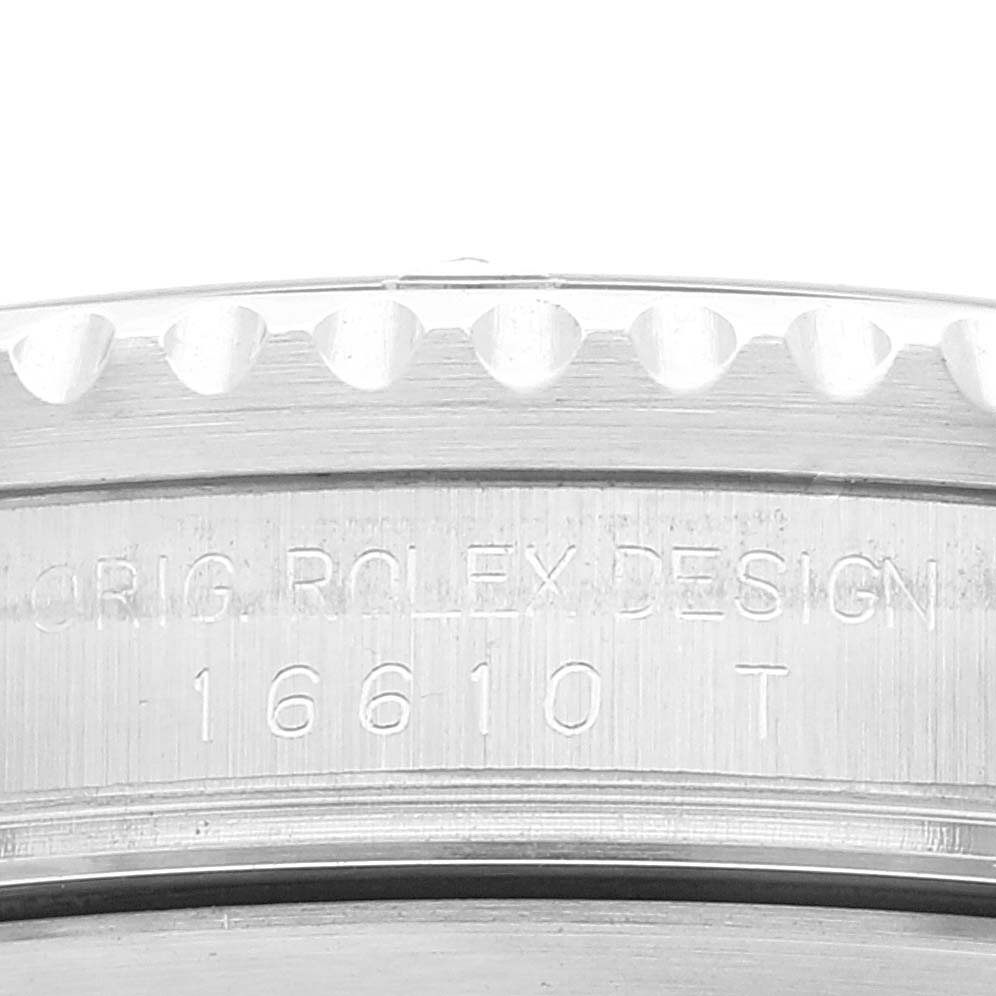 The image shows a close-up of the case side of the Rolex Submariner 16610 Men's Stainless Steel Black Dial 16610 Men's Stainless Steel Black Dial watch, highlighting the engraved model number 16610.