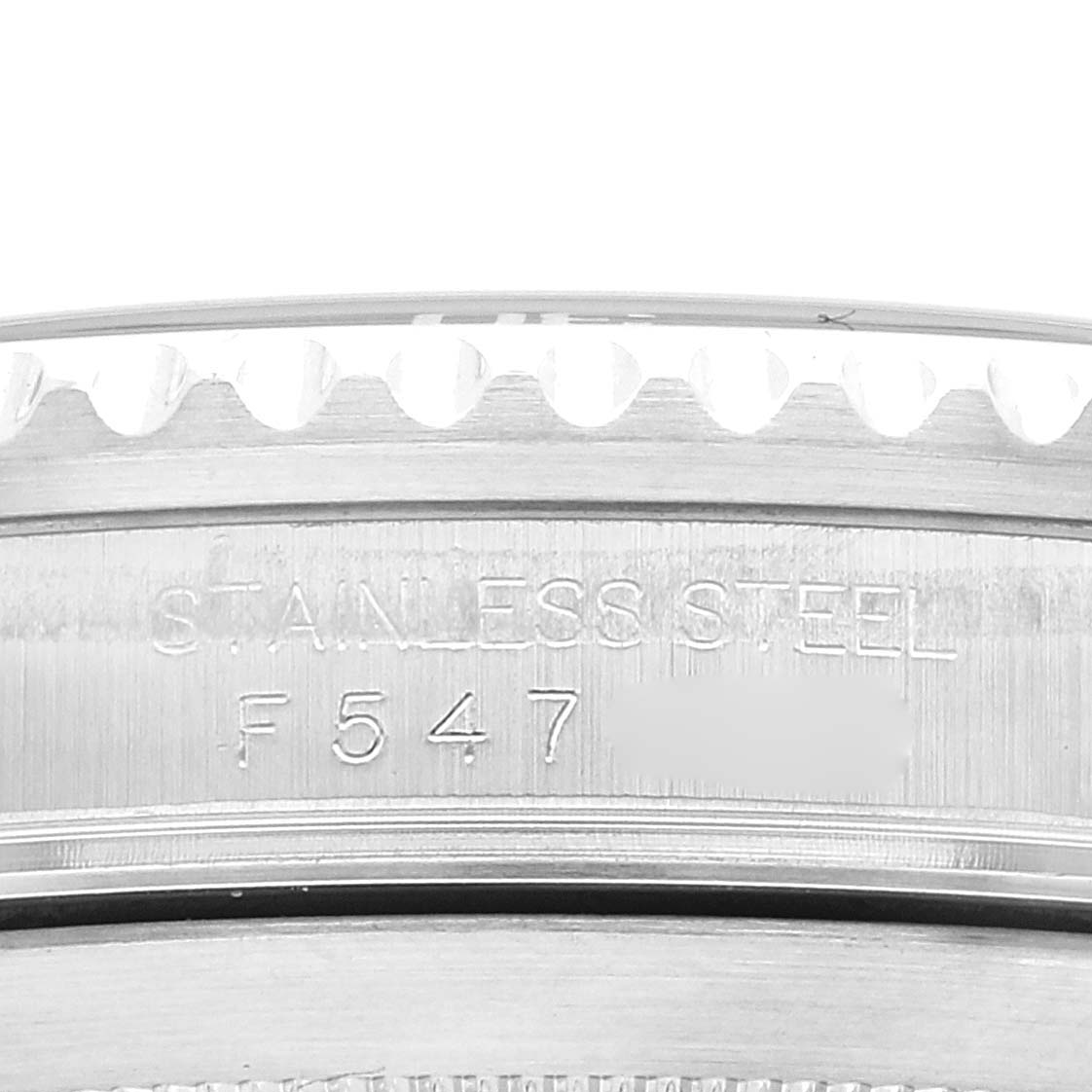 This is a close-up of the side of a Rolex Submariner 16610 Men's Stainless Steel Black Dial 16610 Men's Stainless Steel Black Dial watch, showing the stainless steel engraving and part of the bezel.