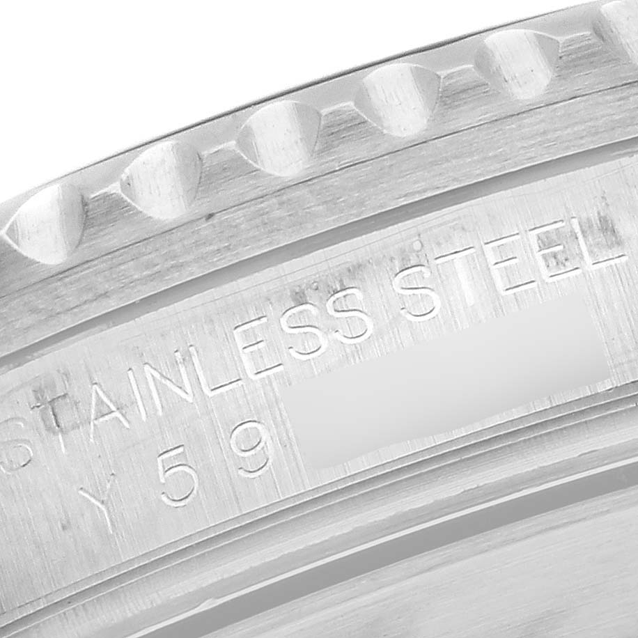 This image shows a close-up of the engraved stainless steel material on the case back of a Rolex Submariner 16610 Men's Stainless Steel Black Dial 16610 Men's Stainless Steel Black Dial watch.