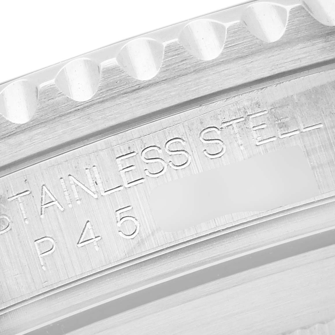 The close-up shows the engraved markings on the stainless steel bezel of a Rolex Submariner 16610 Men's Stainless Steel Black Dial 16610 Men's Stainless Steel Black Dial watch.