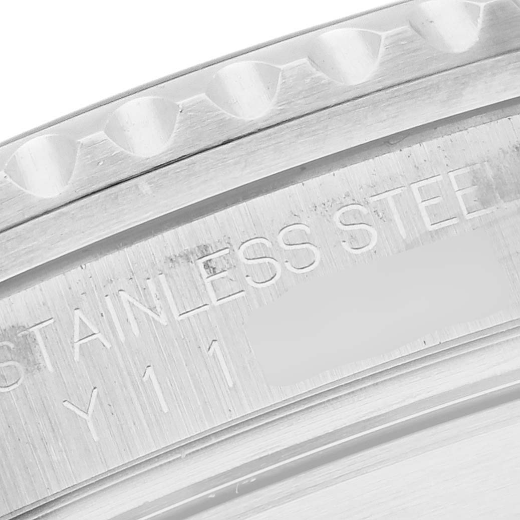 This is a close-up shot of the engraved stainless steel back casing of a Rolex Submariner 16610 Men
s Stainless Steel Black Dial 16610 Men
s Stainless Steel Black Dial watch.