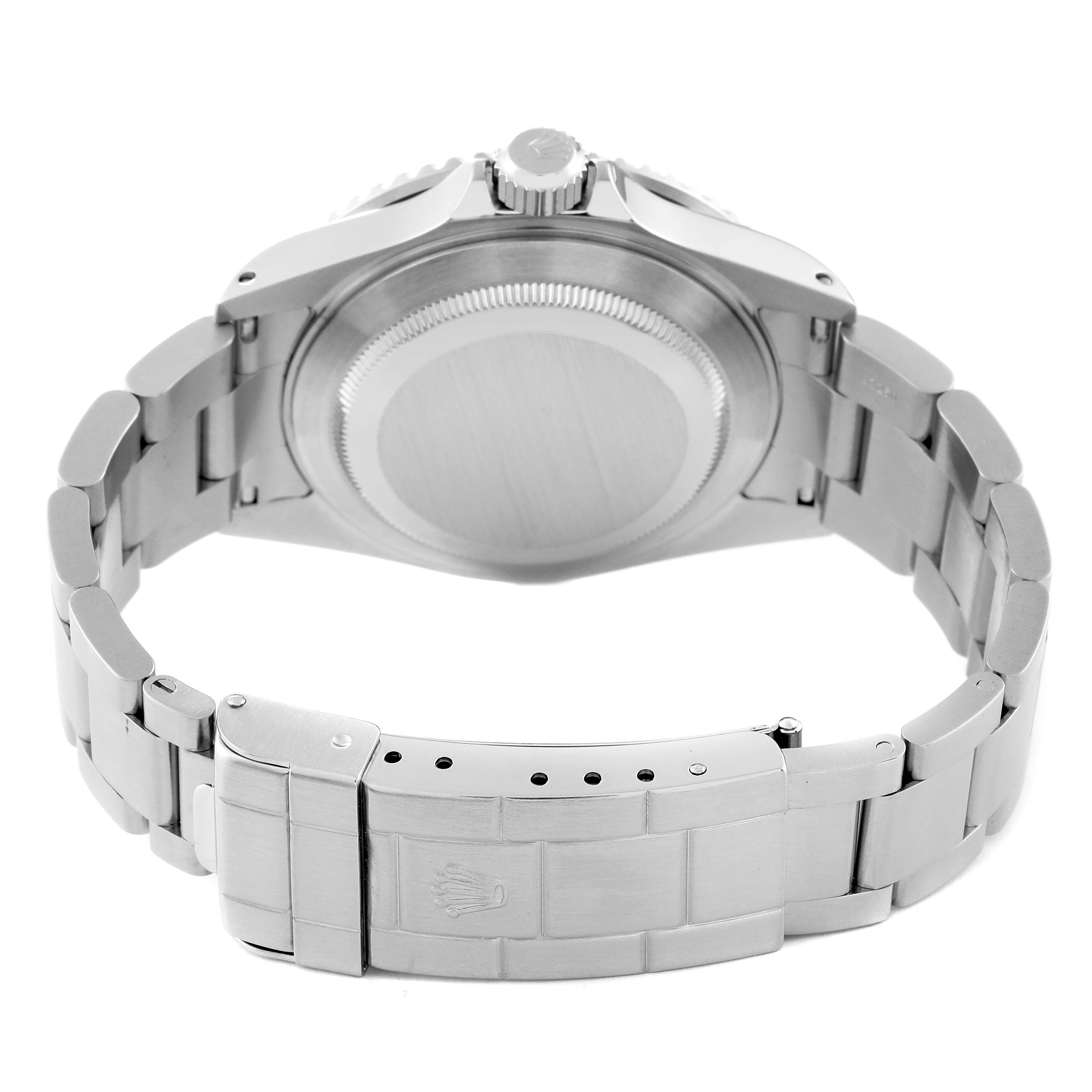 The image shows the back view of a Rolex Submariner 16610 Men
s Stainless Steel Black Dial 16610 Men
s Stainless Steel Black Dial watch, focusing on the case back and the bracelet with the clasp.