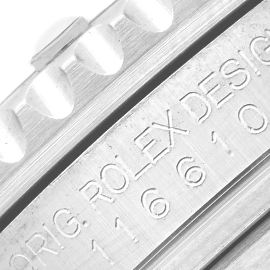 This close-up image shows the bezel edge and engraved side of a Rolex Submariner 116610LV Men's Stainless Steel Green Dial 116610LV Men's Stainless Steel Green Dial watch.
