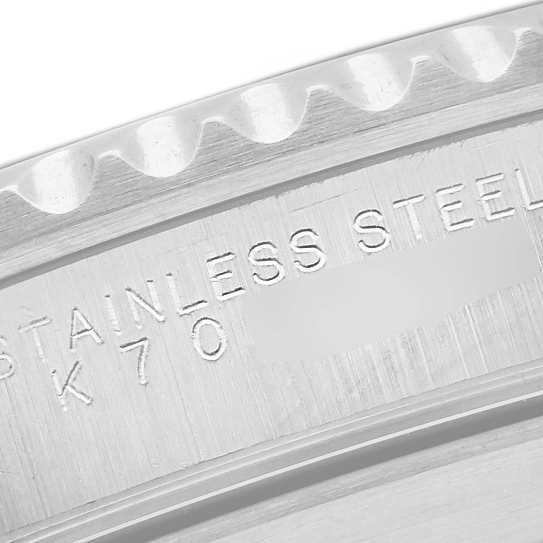 This is a close-up view of the Rolex Submariner 14060 Men's Stainless Steel Black Dial 14060 Men's Stainless Steel Black Dial's engraved stainless steel caseback edge.