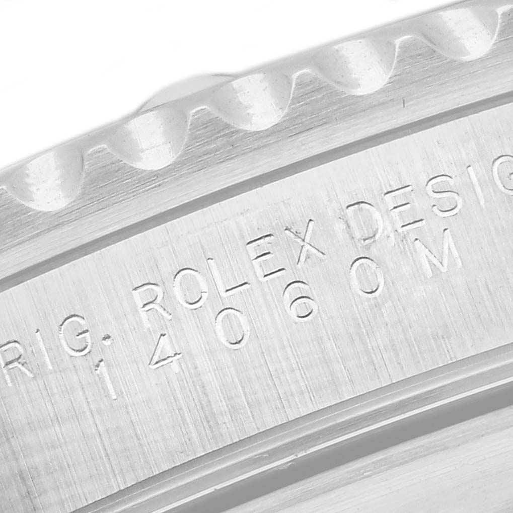 The image shows a close-up view of the engraved model number on the side of a Rolex Submariner 14060 Men's Stainless Steel Black Dial 14060 Men's Stainless Steel Black Dial watch case.