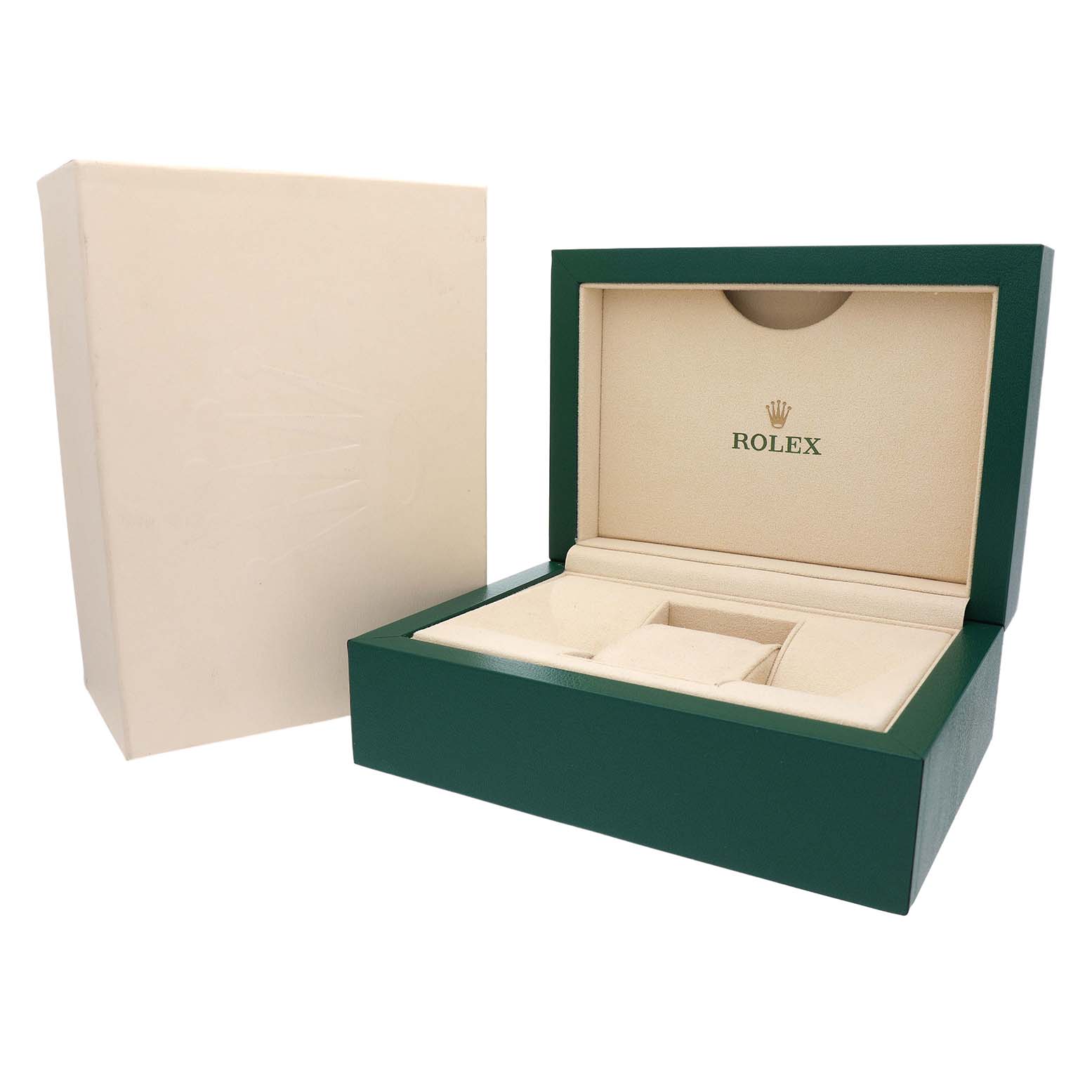 The image shows the open green Rolex box and beige outer box, featuring the Rolex logo, for the Submariner model.
