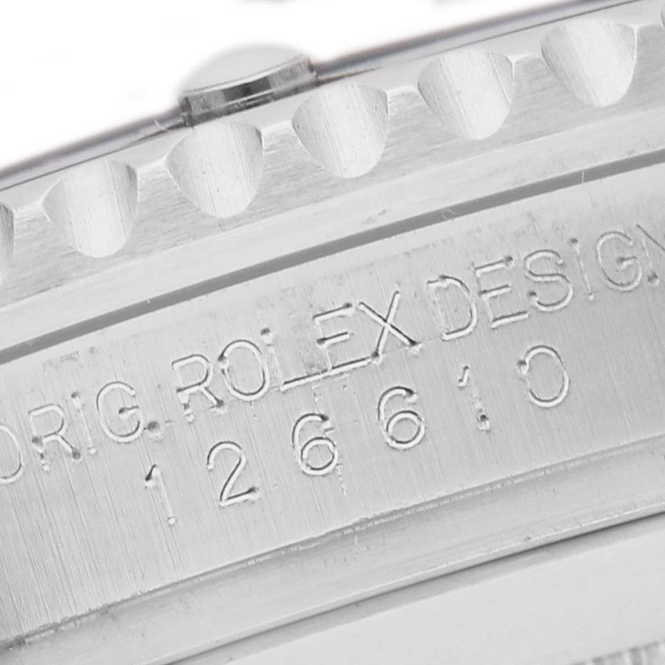 The image shows a close-up of the bezel and engraved serial number on a Rolex Submariner 126610LV Men's Stainless Steel Black Dial.