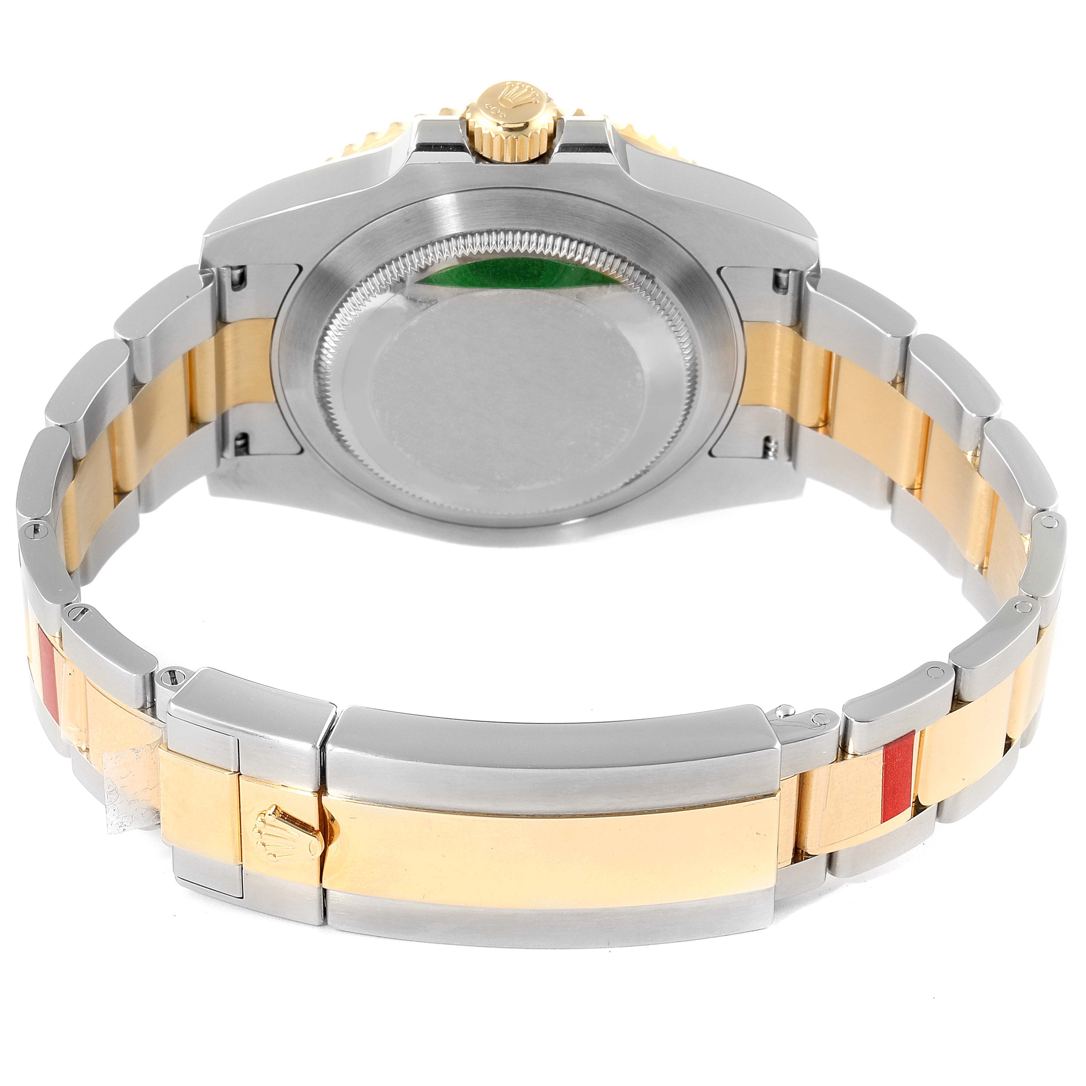 The image shows the back and bracelet of a Rolex Submariner 116613 Men
s Steel and Gold (two tone) Black Dial 116613 Men
s Steel and Gold (two tone) Black Dial watch, displaying its clasp and case back.