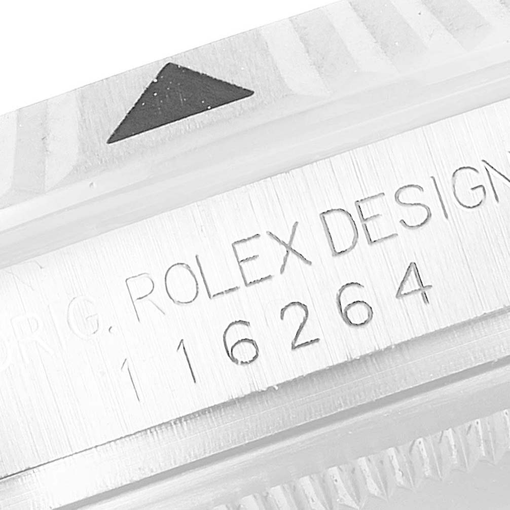 This image shows a close-up of the bezel and serial/engraving area of the Rolex Turn-o-Graph 116264 Men's Stainless Steel White Dial 116264 Men's Stainless Steel White Dial model watch.