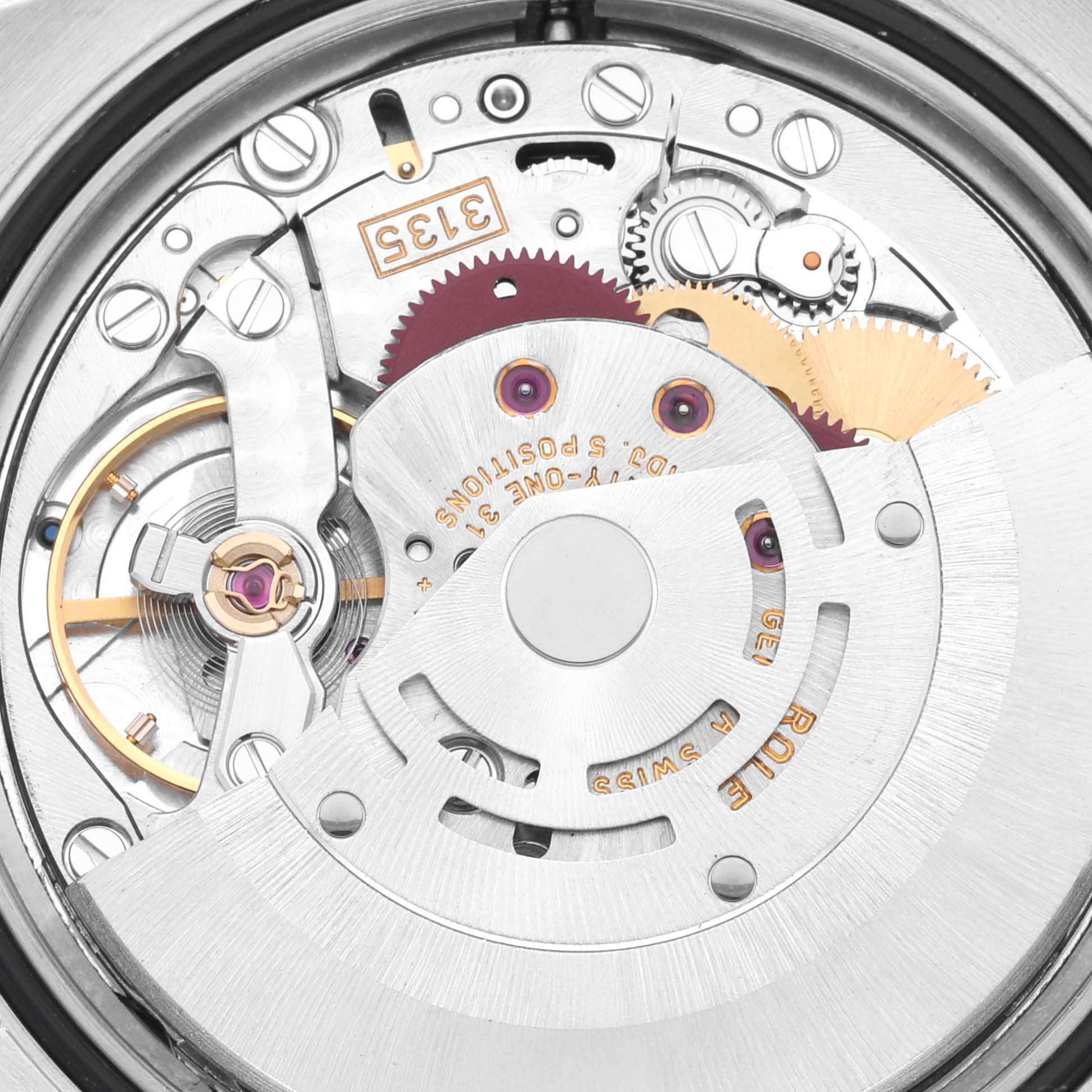 The image shows a close-up of the movement mechanism of a Rolex Turn-o-Graph 116264 Men's Stainless Steel Black Dial 116264 Men's Stainless Steel Black Dial watch, highlighting gears and the rotor.