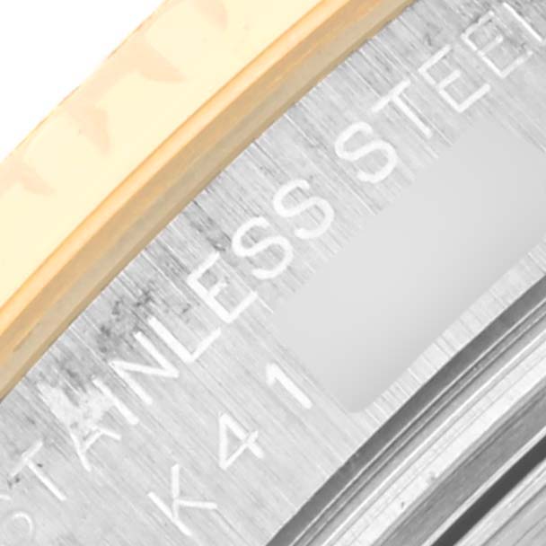 This close-up image shows part of the bezel and case back of the Rolex Yacht-Master 169623 Women's Steel and Gold (two tone) White Dial 169623 Women's Steel and Gold (two tone) White Dial watch, highlighting the stainless steel engraving.