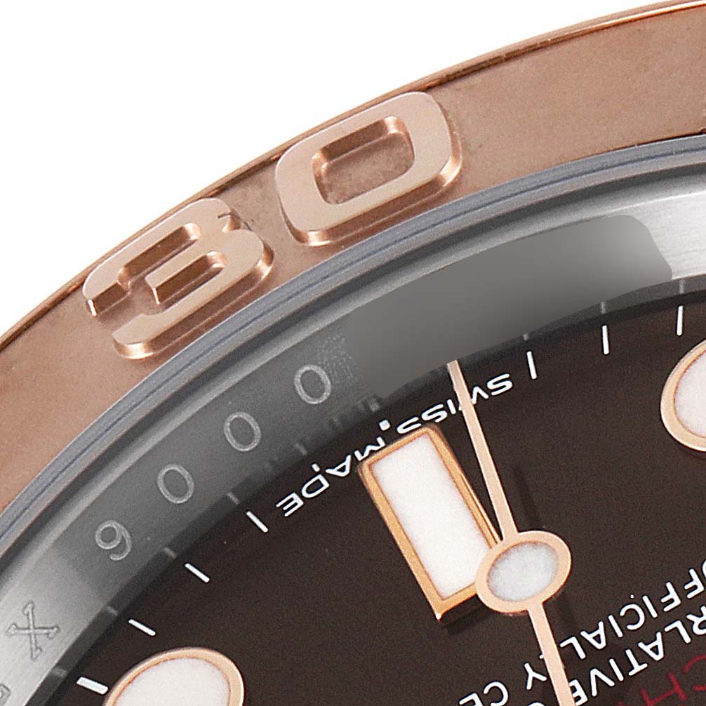 This close-up image shows the Rolex Yacht-Master 116621 Men's Steel and Gold (two tone) Brown Dial 116621 Men's Steel and Gold (two tone) Brown Dial's bezel with a "30" marker and part of the dial.