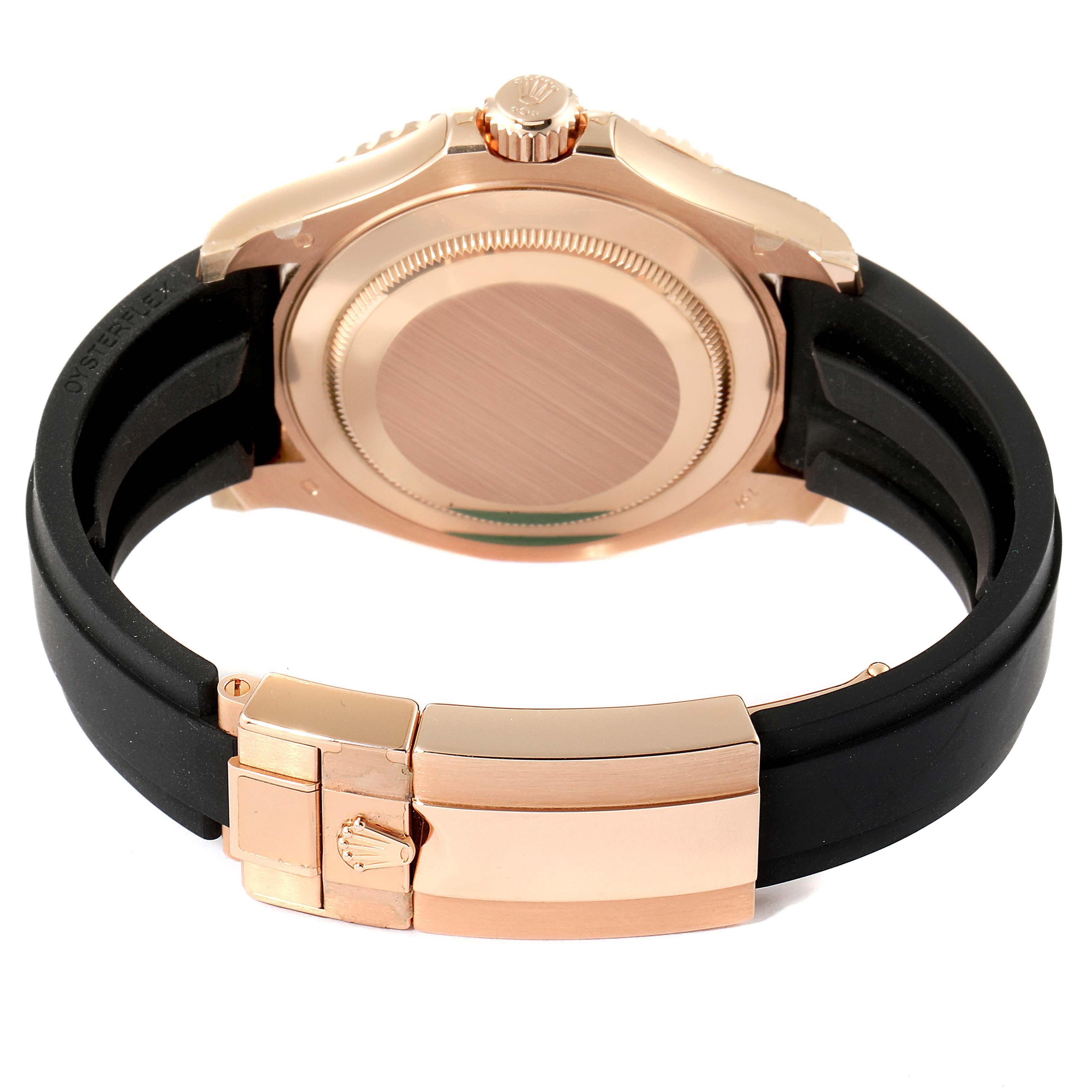 This image shows the back view of the Rolex Yacht-Master 116655 Men's Rose Gold Black Dial 116655 Men's Rose Gold Black Dial watch, highlighting the case, crown, and black rubber strap with a clasp.